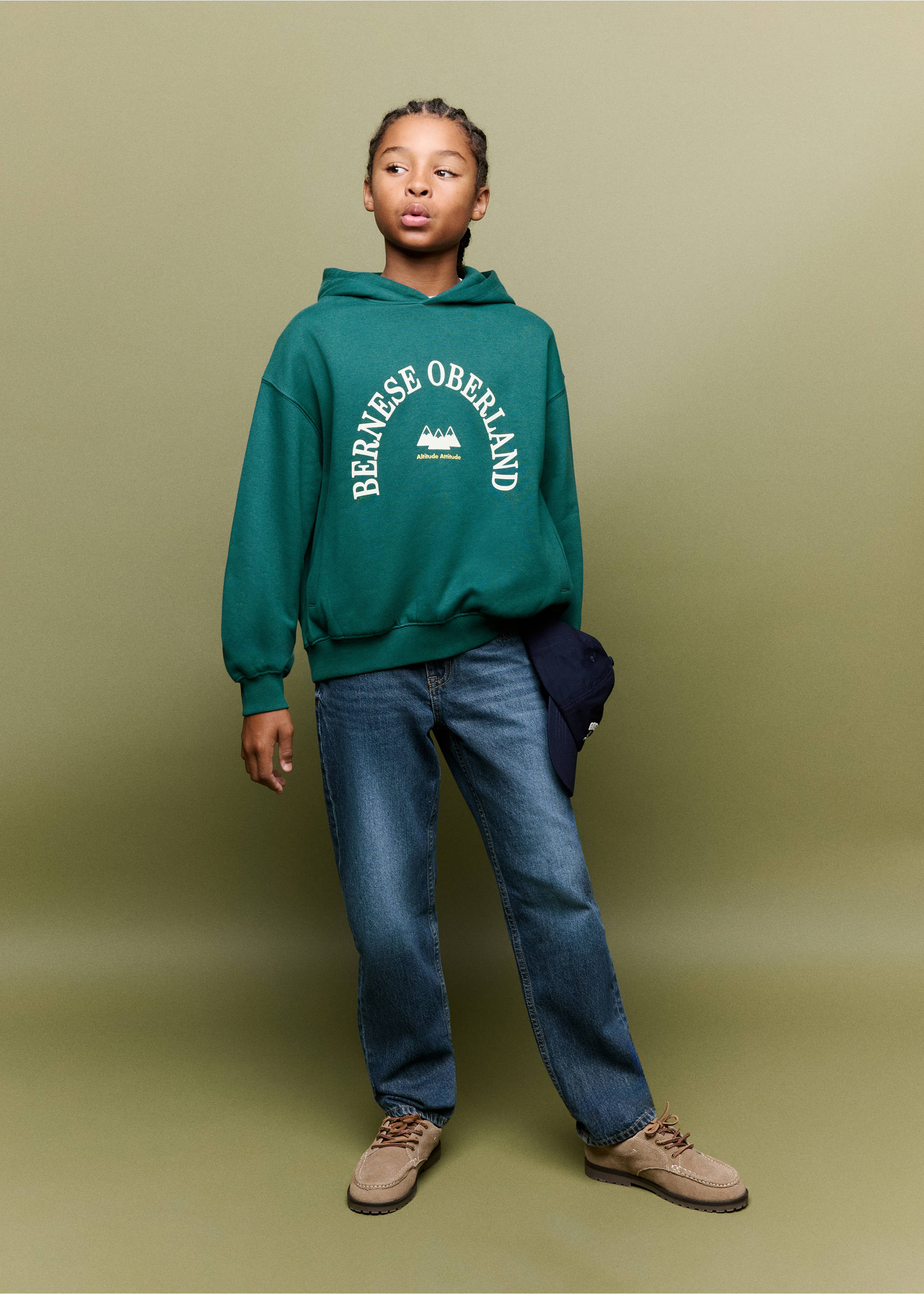 Green hooded sweatshirt with white Bernese Oberland chest text, worn with blue jeans., Billiard Green. Ref: 37087119-00.