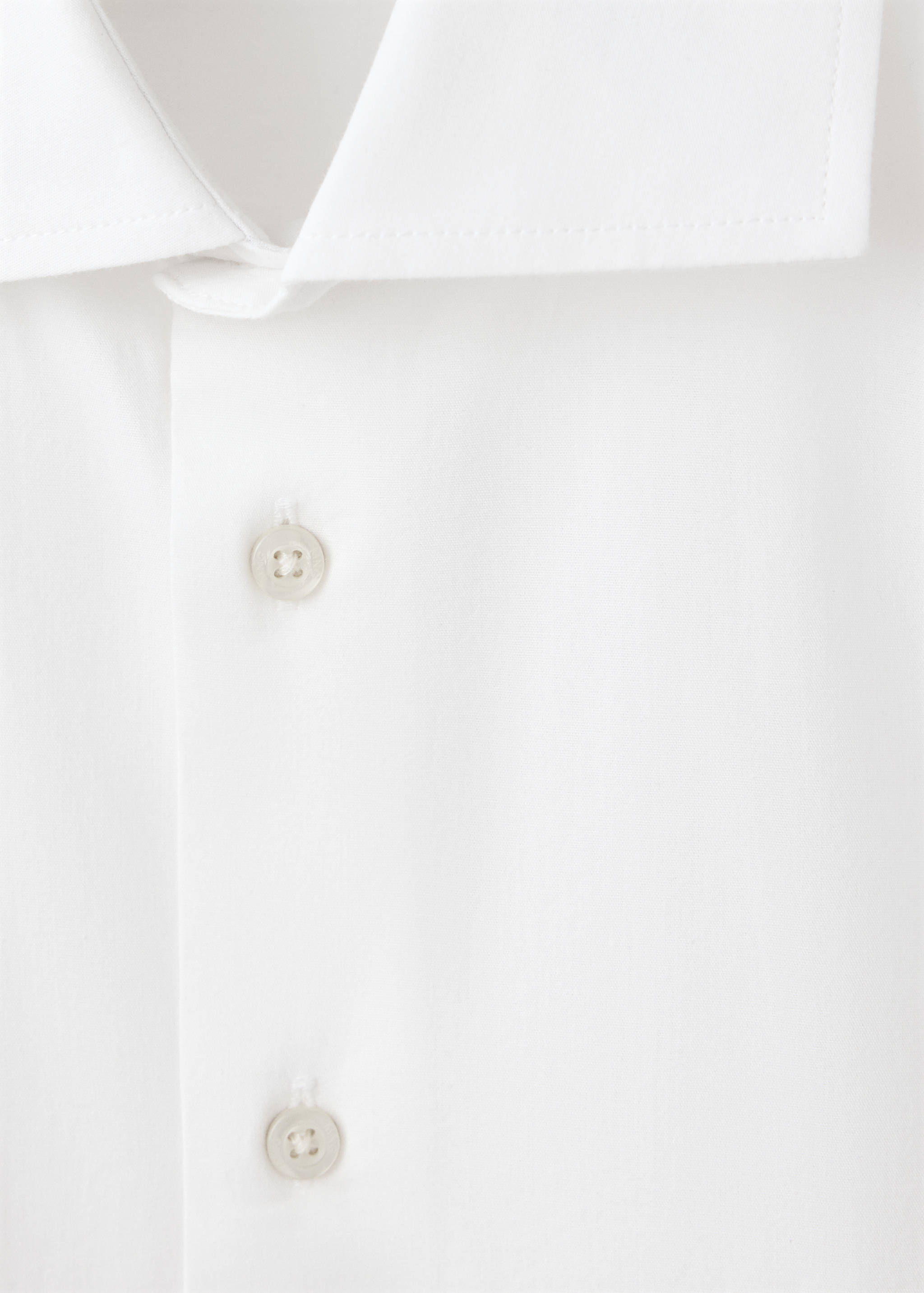 White shirt collar and button placket detail.