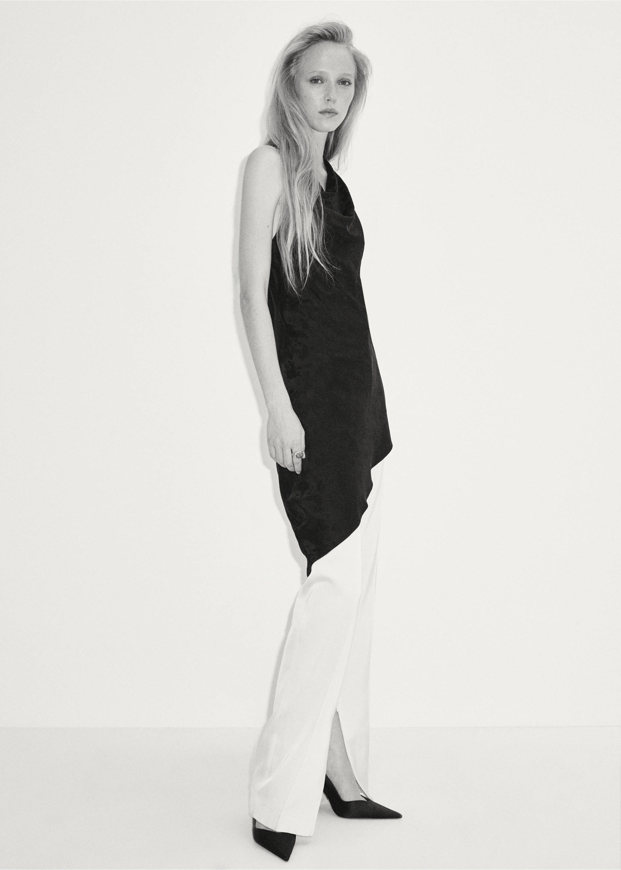 Black sleeveless asymmetric cowl-neck top paired with white trousers., Black. Ref: 37087783-00.