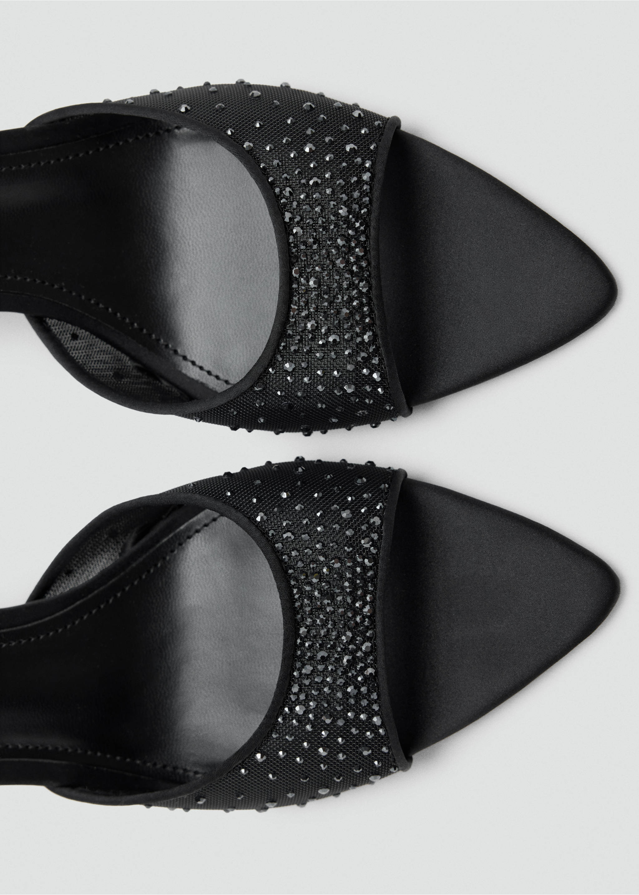 Black sandals with pointed toes and rhinestone-embellished straps., Black. Ref: 37087785-00.