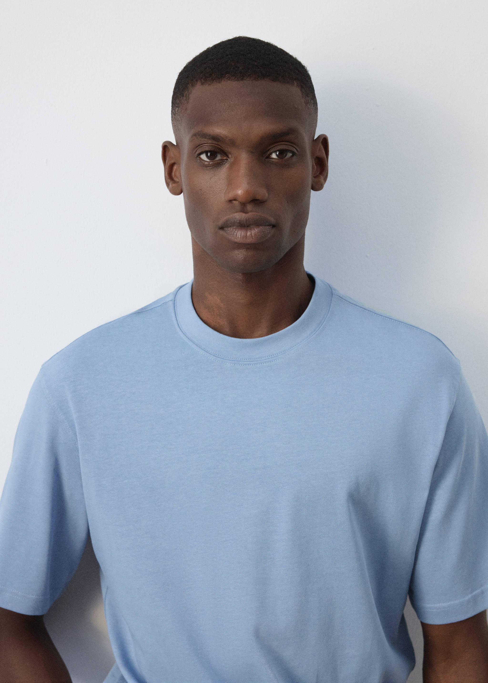 Light blue short-sleeved t-shirt with a ribbed crew neck.