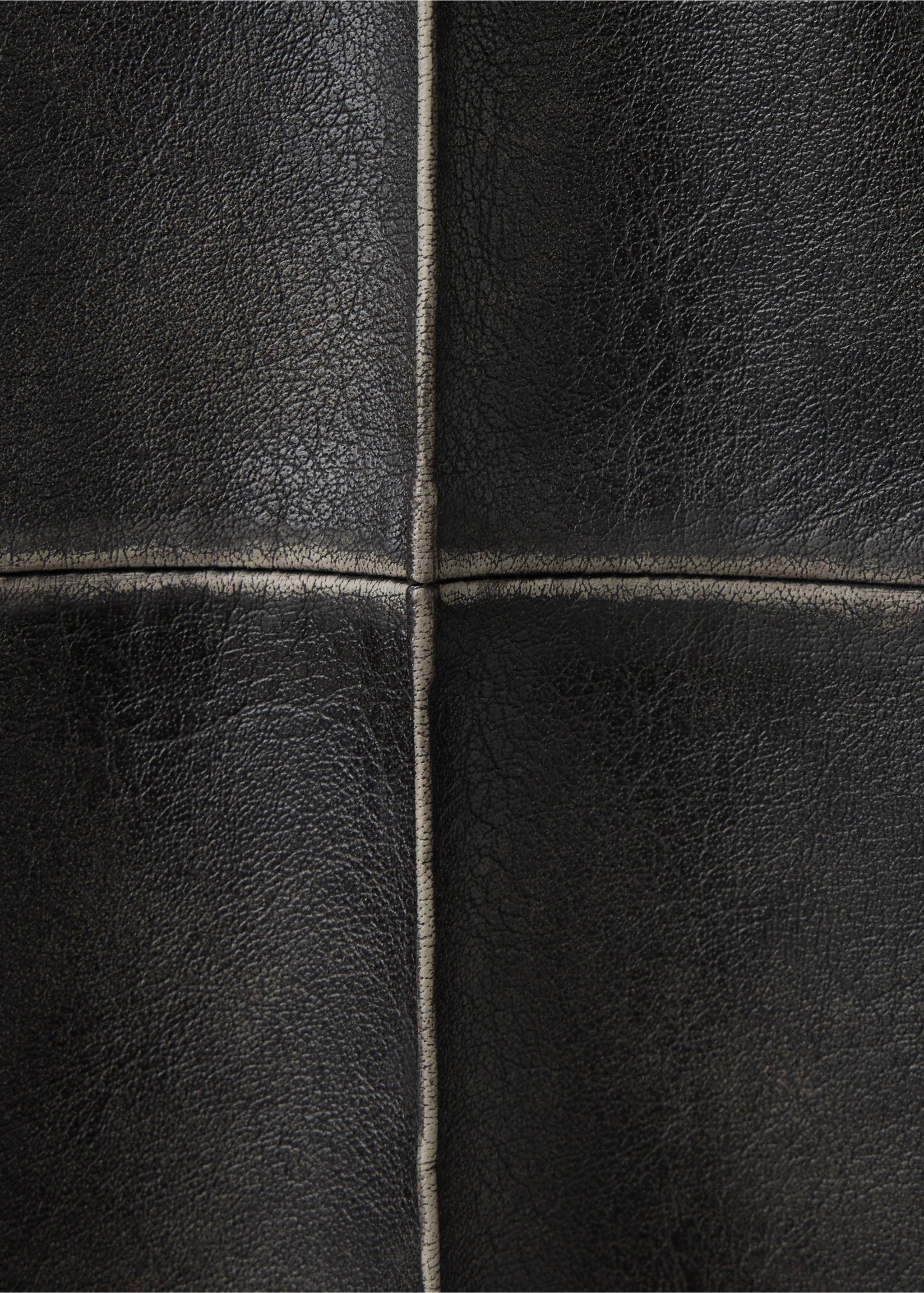 Close-up of black trousers showing the textured fabric and contrasting seams., Black. Ref: 37087788-00.