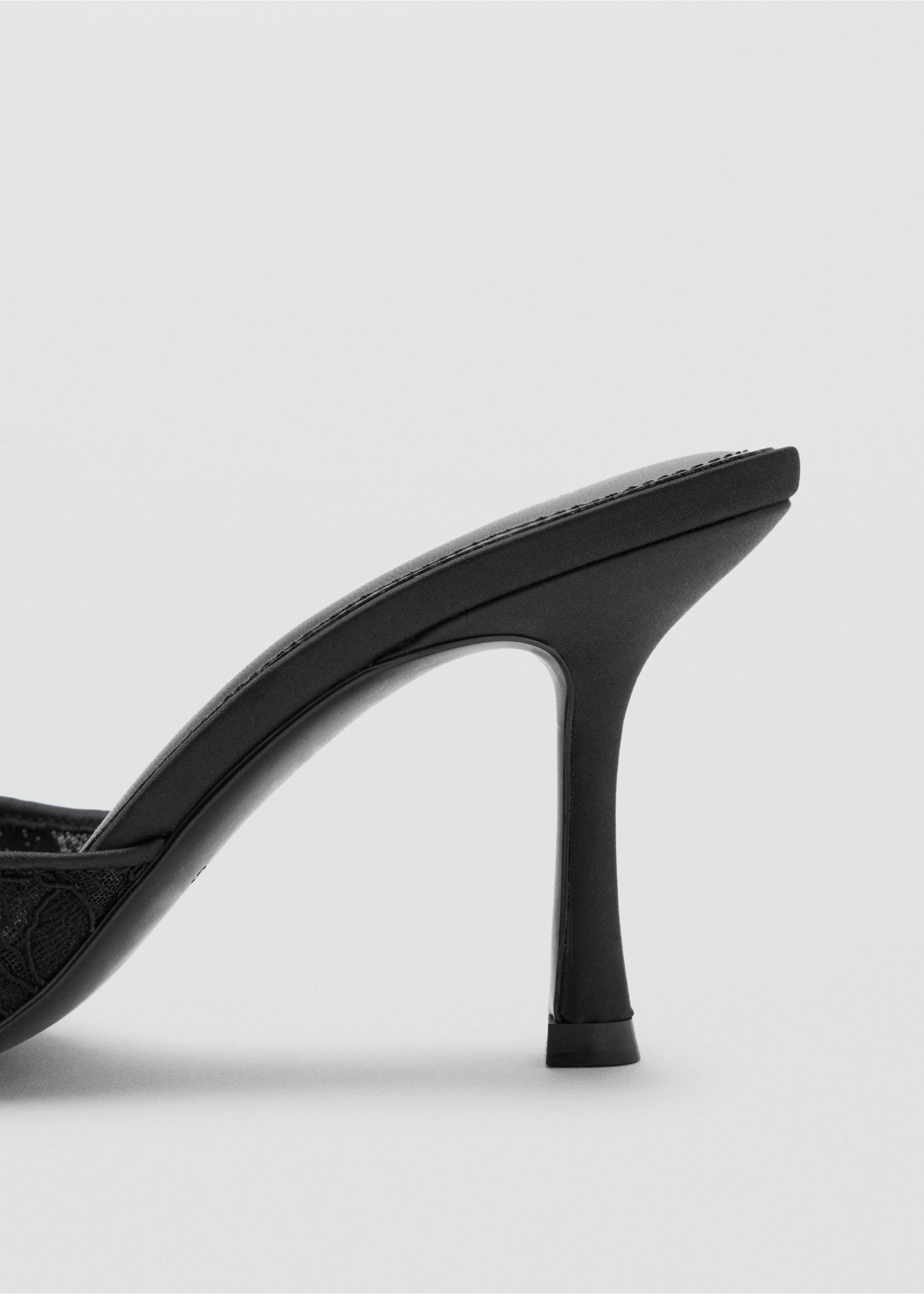Close-up of a black heeled sandal featuring a slim stiletto heel., Black. Ref: 37087792-00.