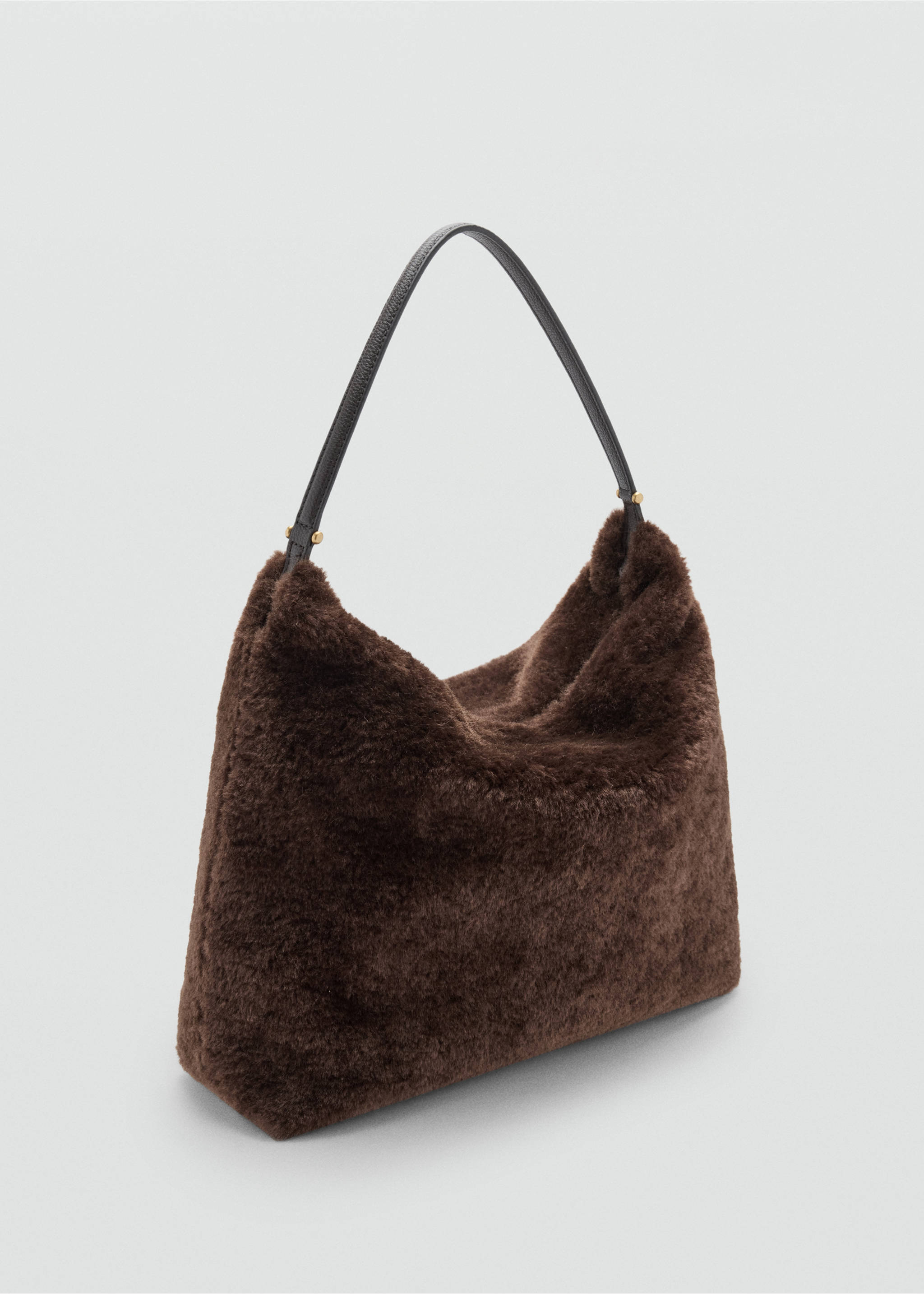Dark brown faux-fur shoulder bag with a dark leather strap in a three-quarter view., Chocolate. Ref: 37087797-00.