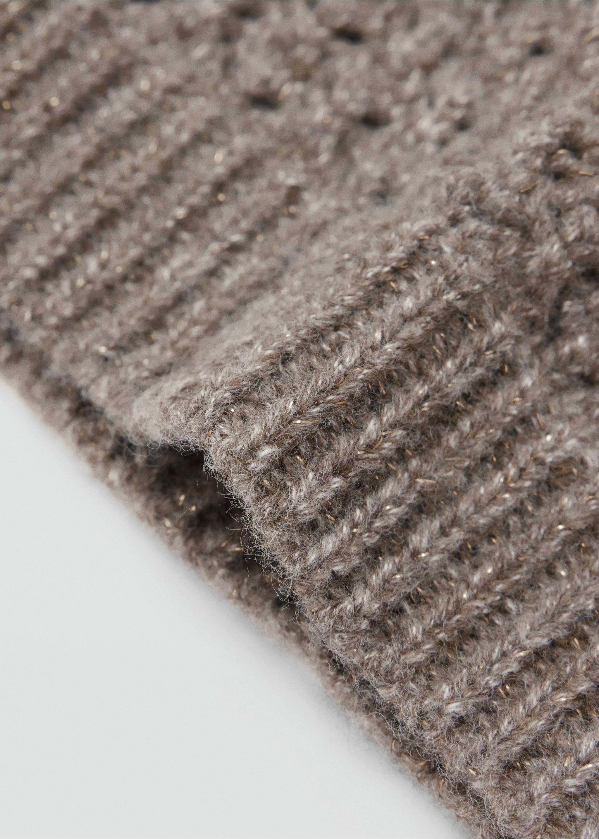 Close-up of a grey knit hat showing the textured ribbed cuff., Medium Brown. Ref: 37087798-00.