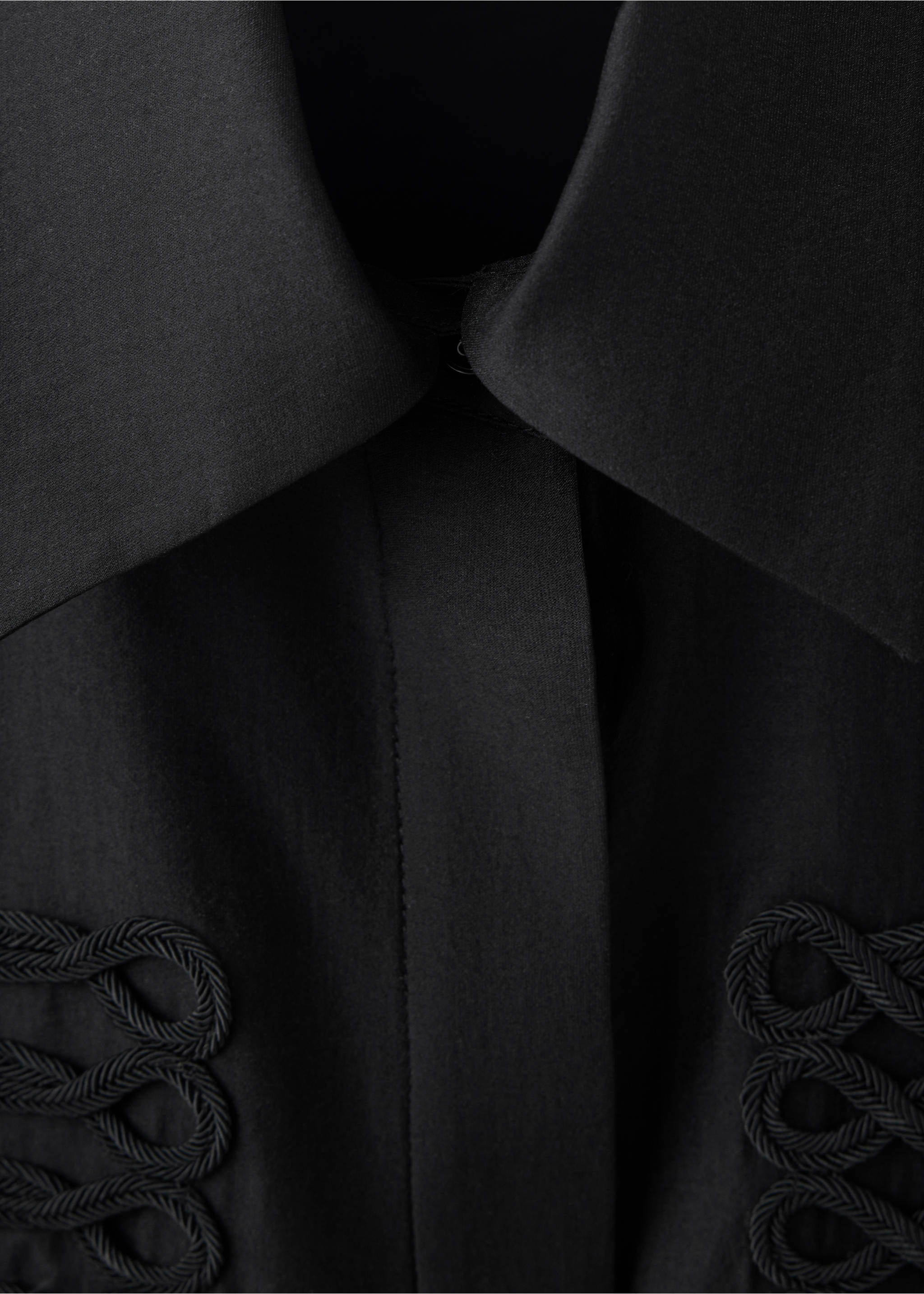 Close-up of a black shirt with a classic collar and tonal braided cord embroidery., Black. Ref: 37087802-00.