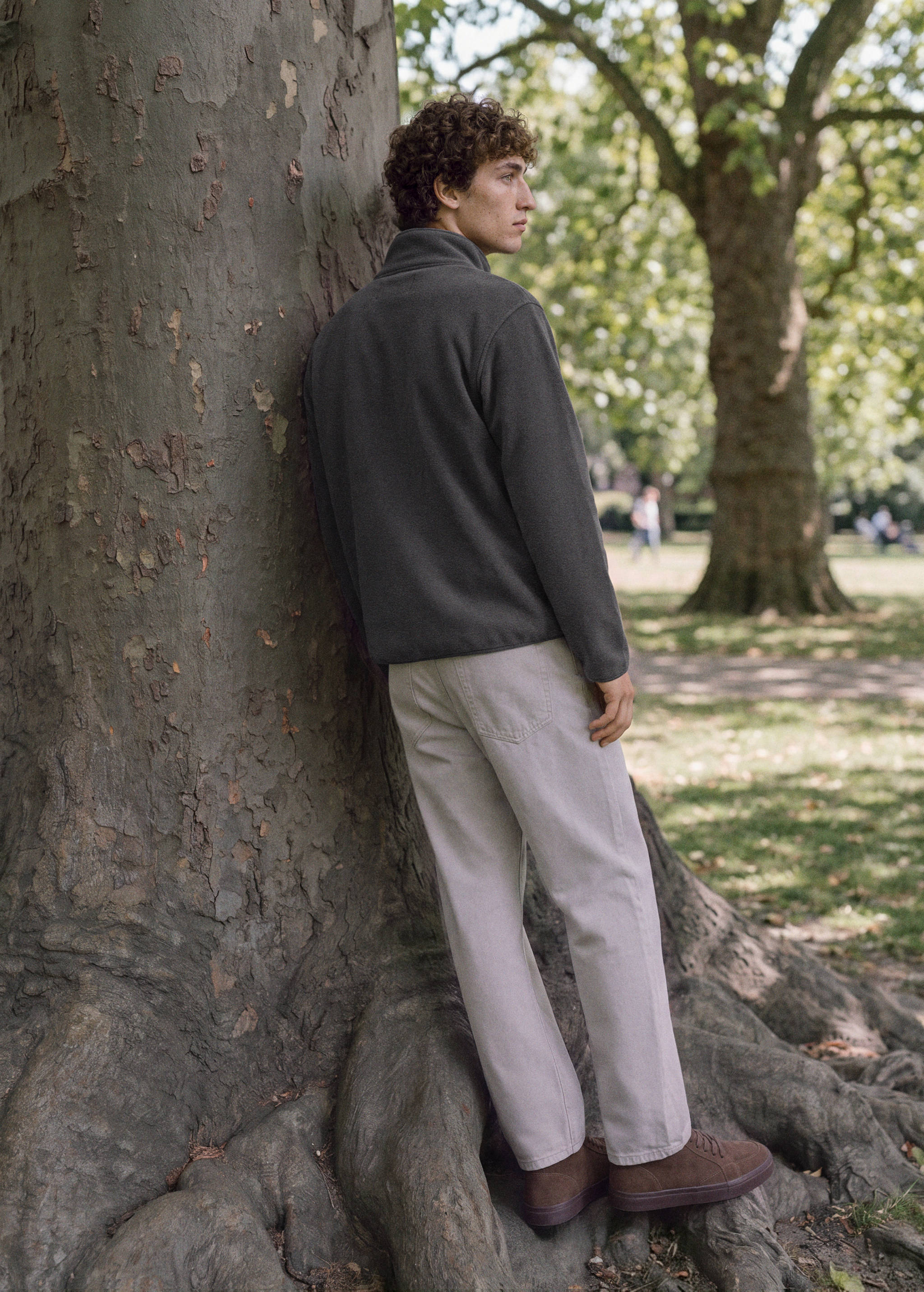 Dark grey sweatshirt with zip collar, back view.