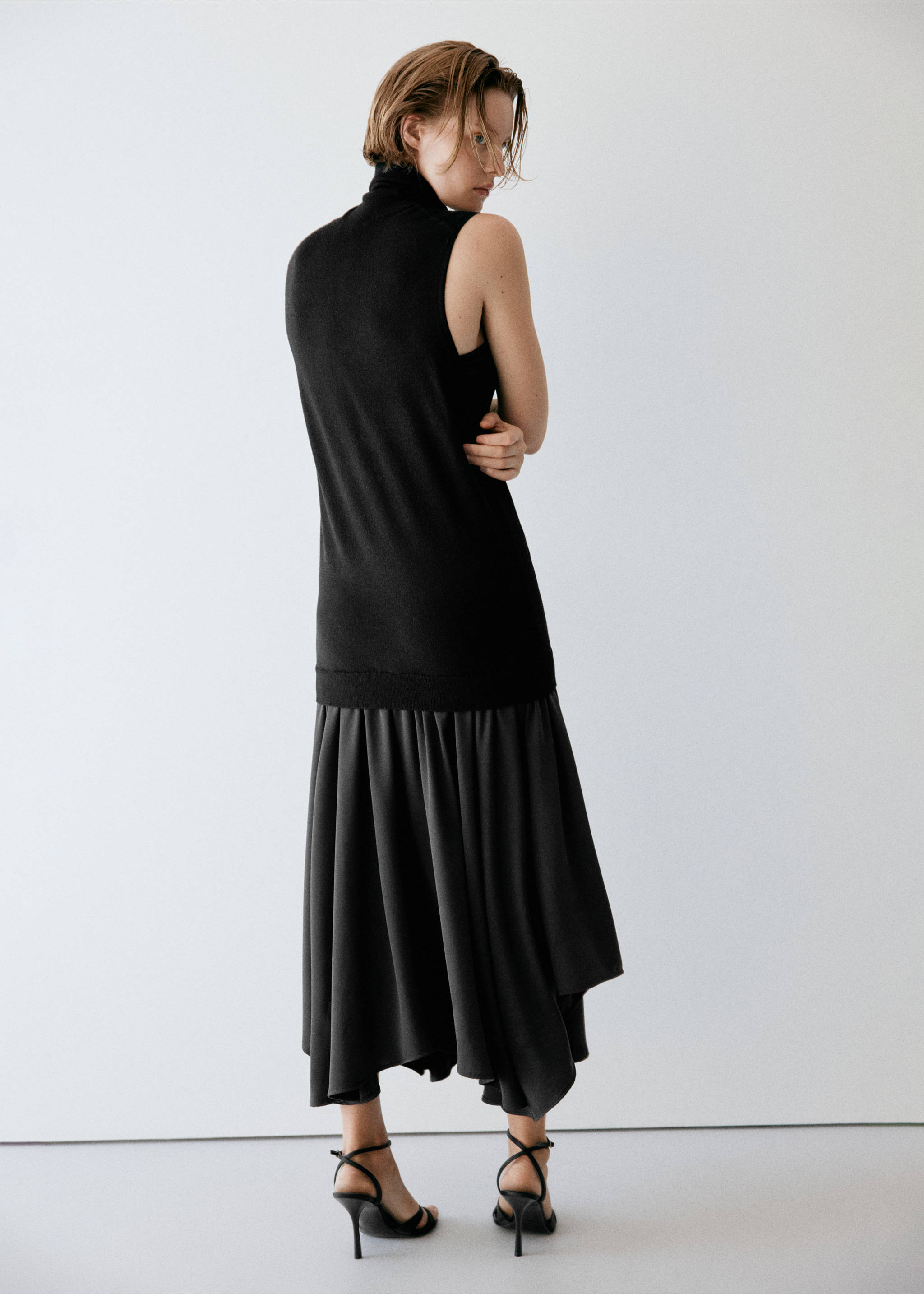 Back view of a black sleeveless midi dress with a high collar and pleated skirt., Black. Ref: 37087811-00.