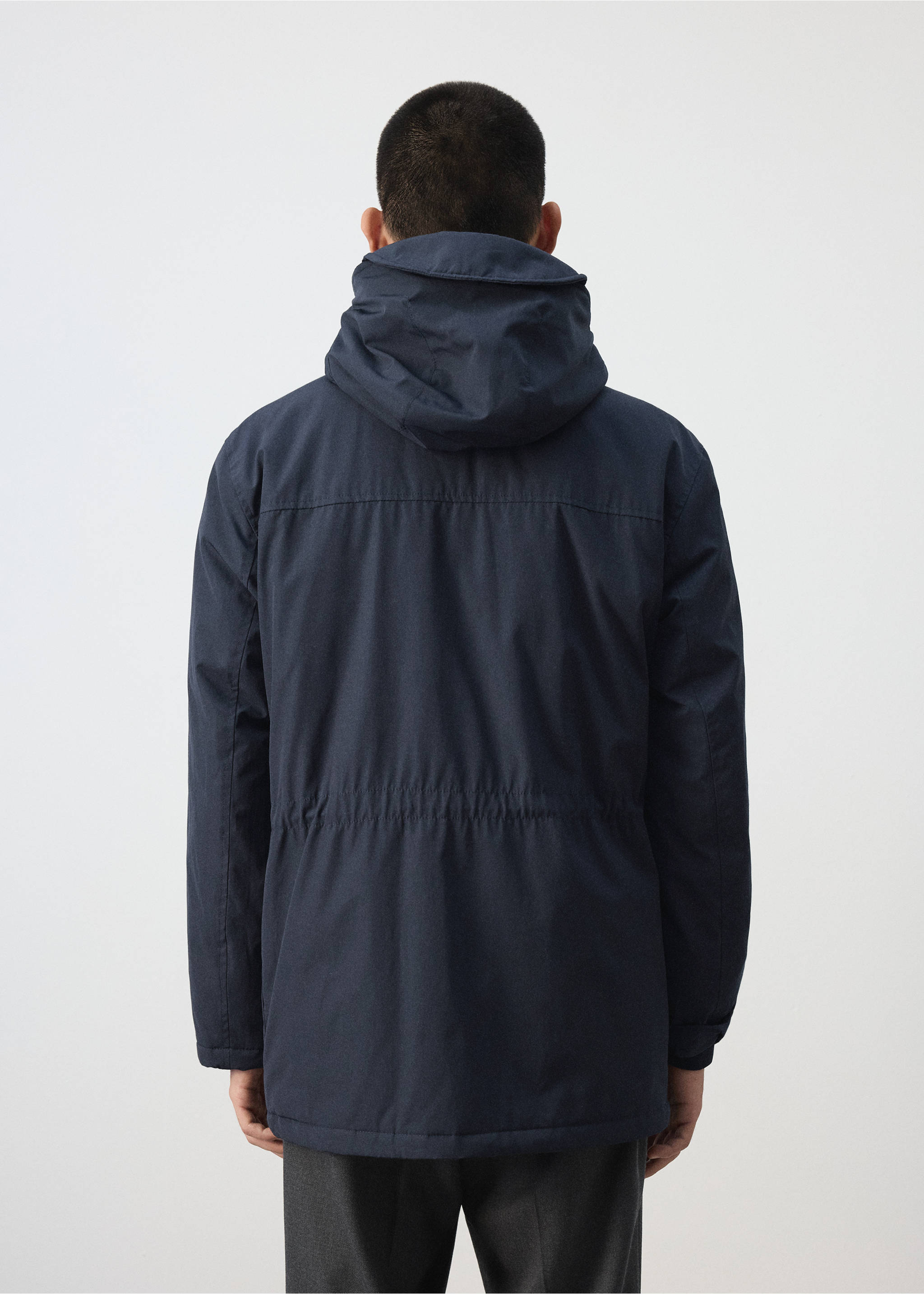 Navy blue parka with a hood and drawstring waist, back view., Night Blue. Ref: 37087883-00.