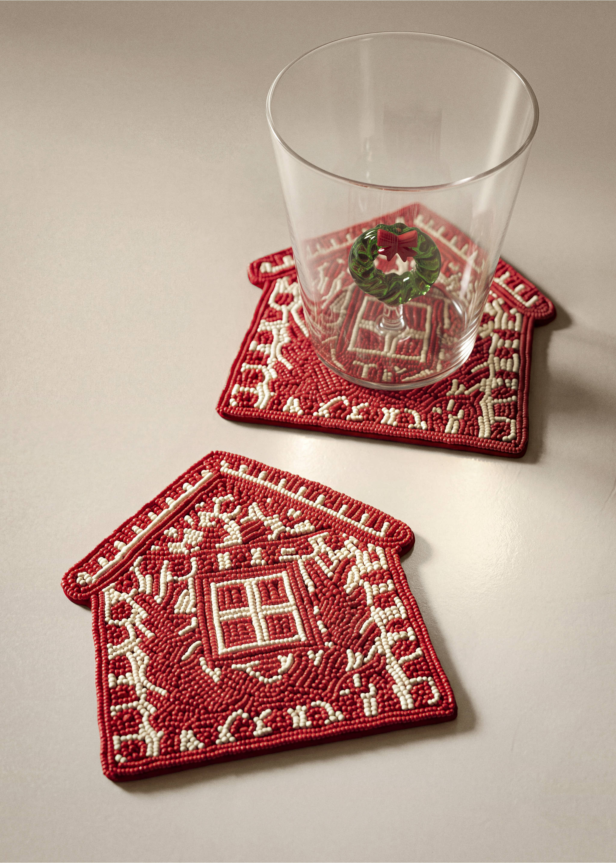 House-shaped red and white beaded coasters with gingerbread house design., Red. Ref: 37087893-00.