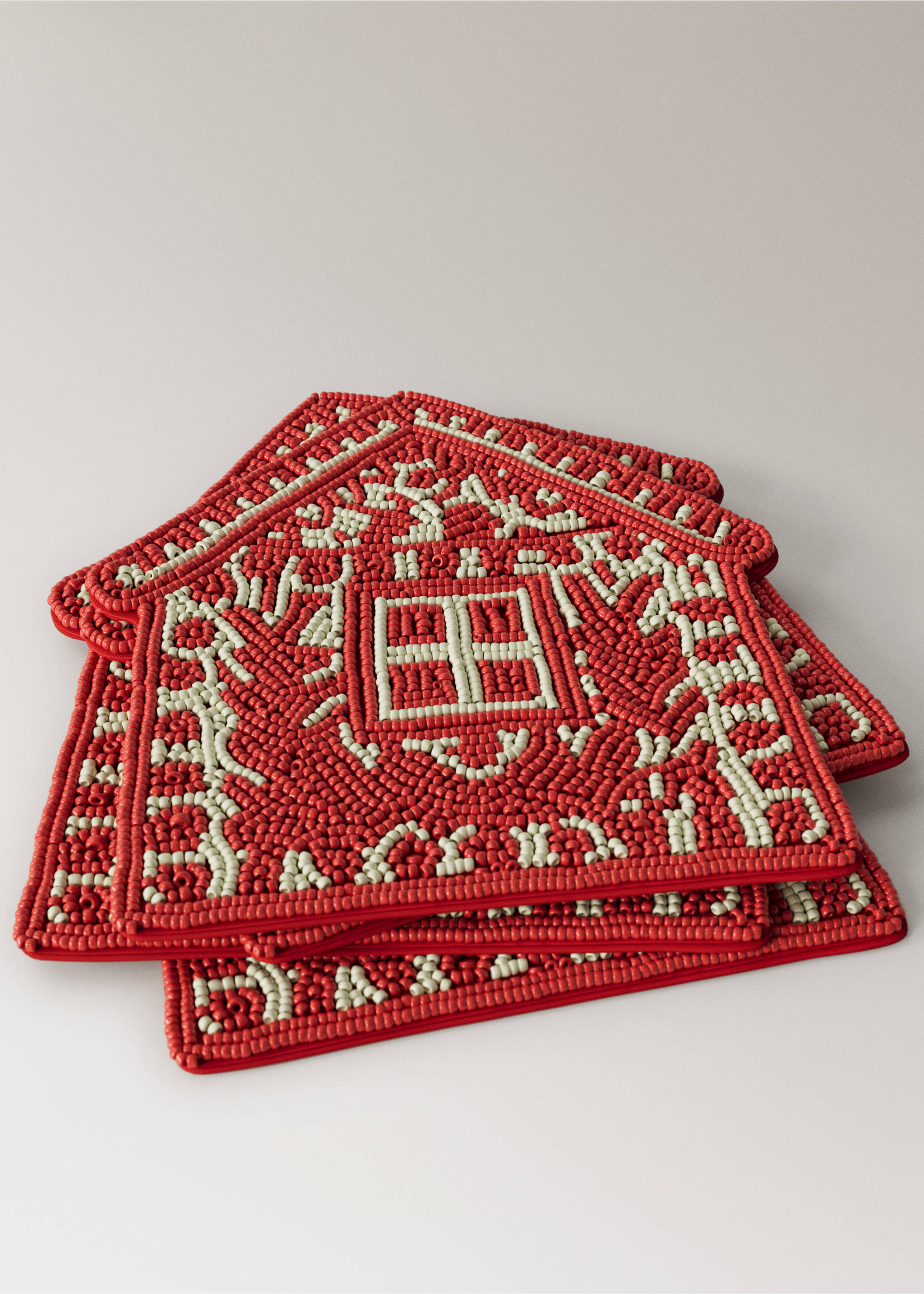 House-shaped red and cream beaded coaster detail., Red. Ref: 37087893-00.