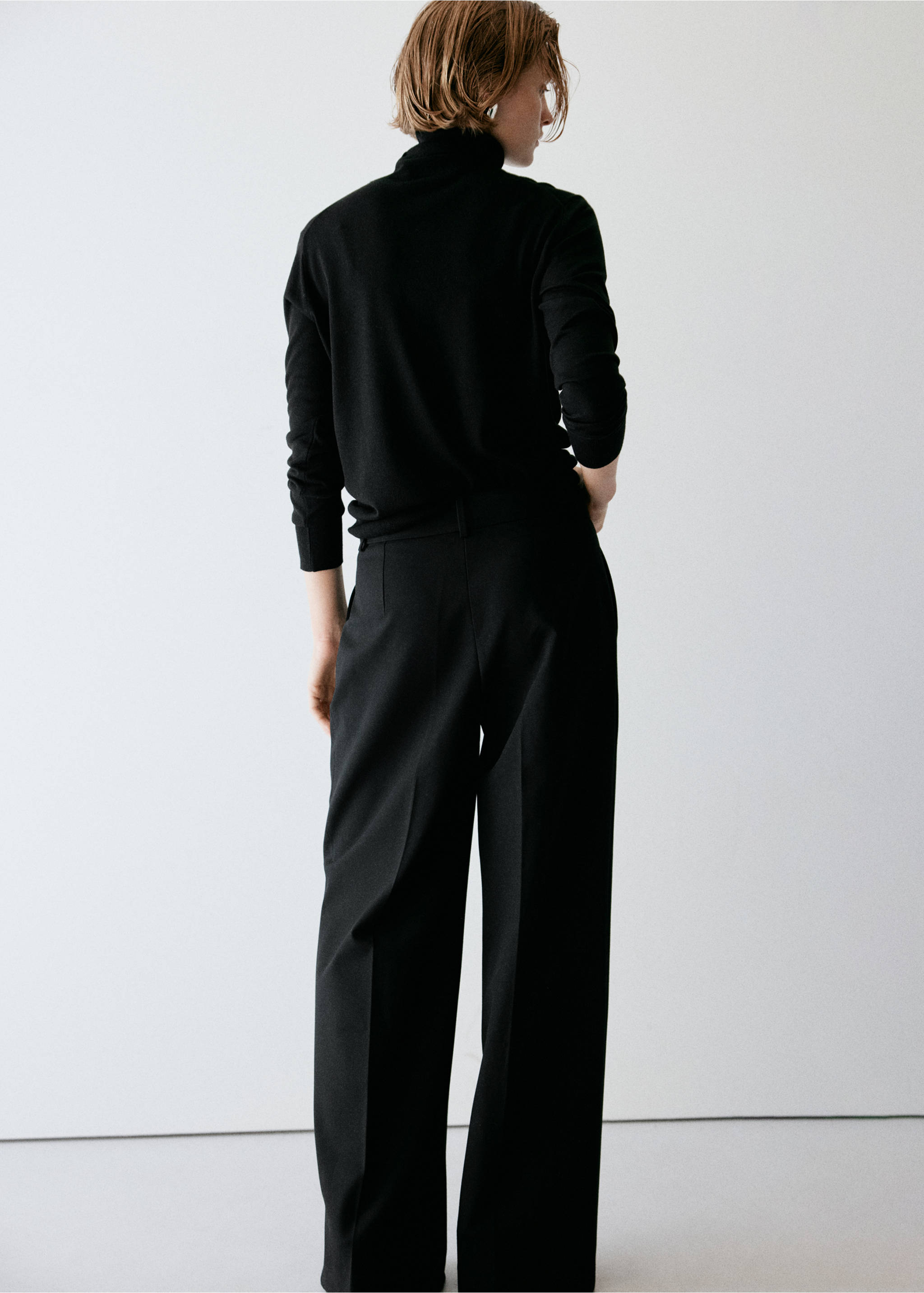 Back view of black wide-leg trousers with pressed creases., Black. Ref: 37087898-00.