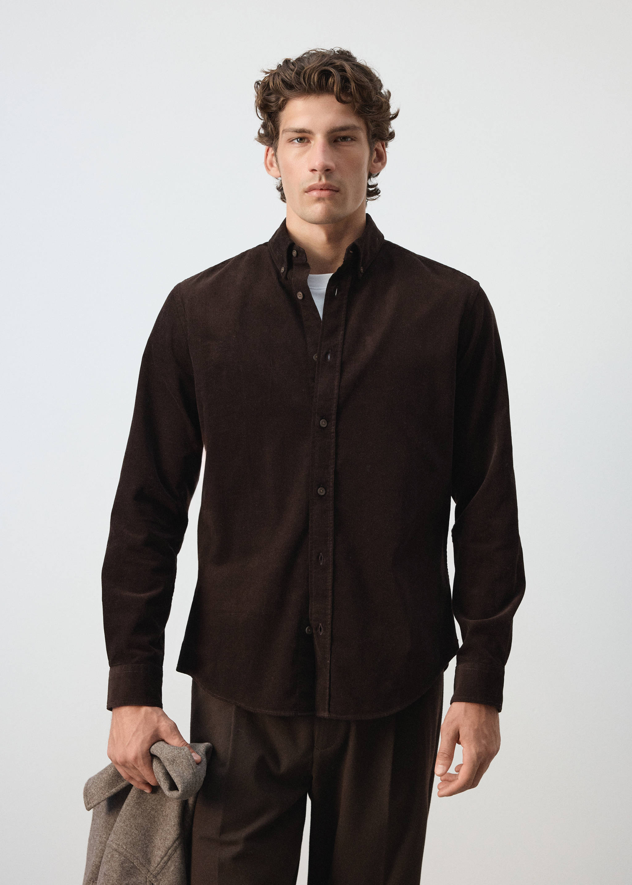 Dark brown corduroy long-sleeve shirt with a button-down collar.
