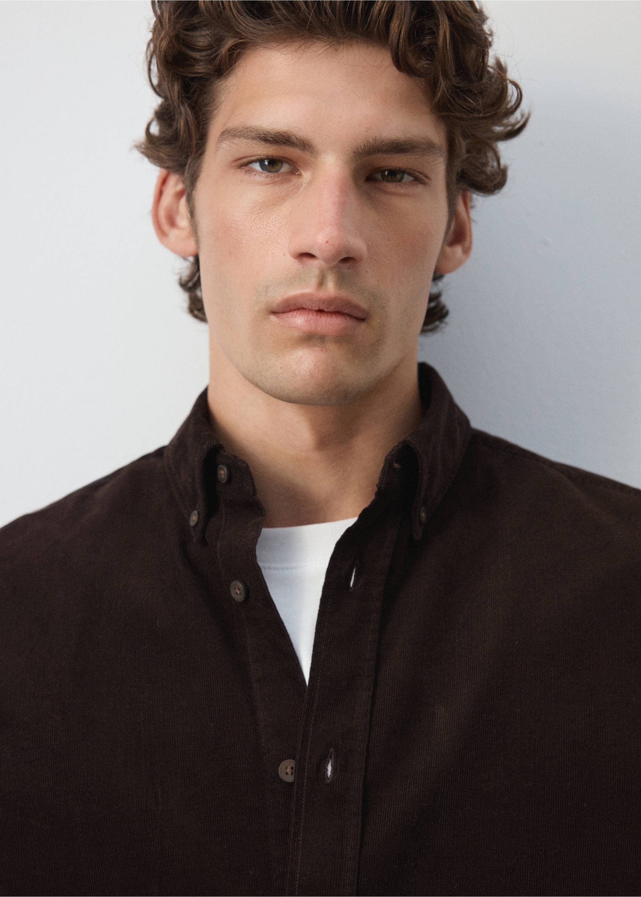 Close-up of a dark brown corduroy shirt worn with a white t-shirt., Chocolate. Ref: 37087900-00.