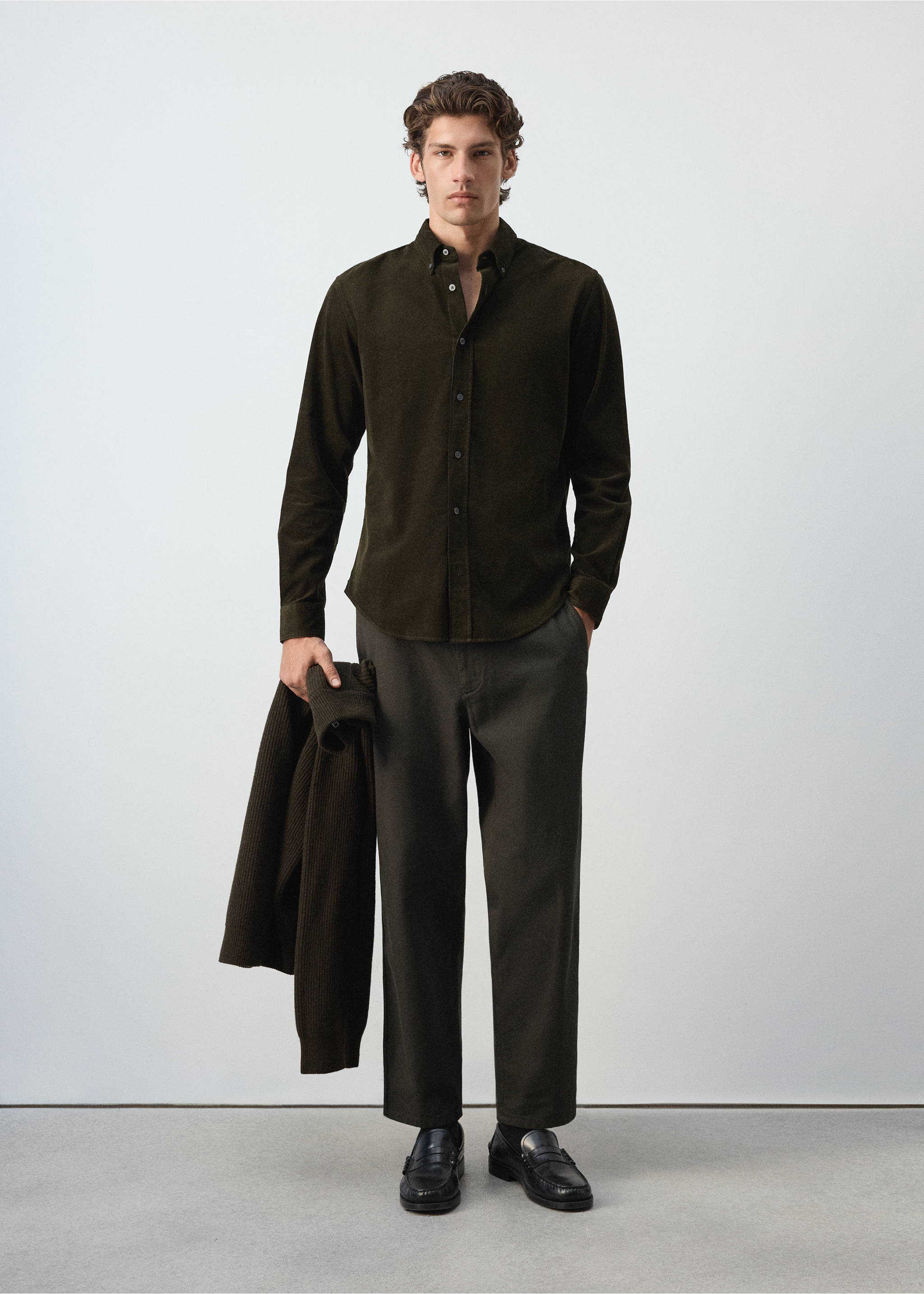 Dark olive green long-sleeve shirt with a button-down collar worn with dark trousers., Dark Green. Ref: 37087900-00.