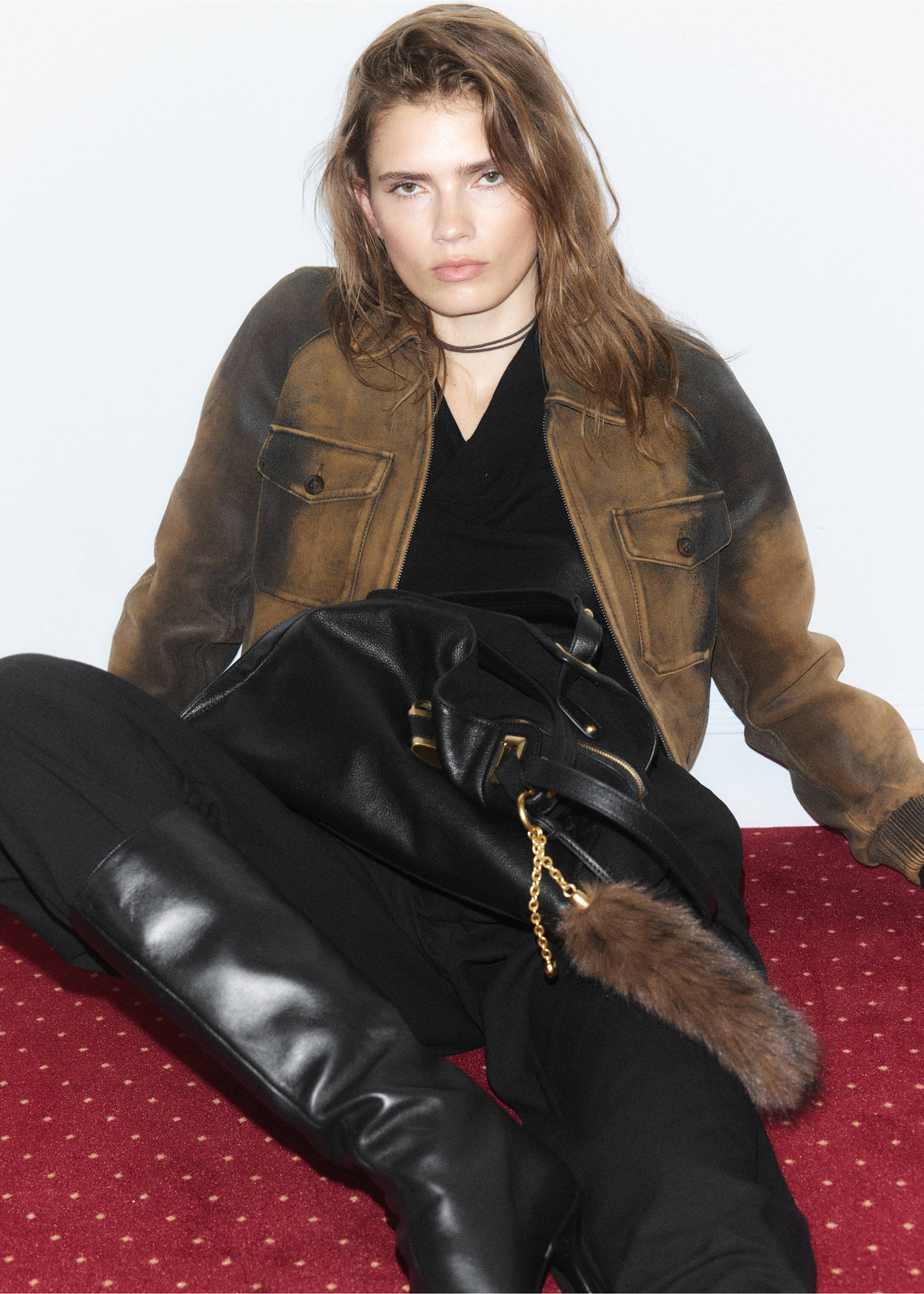 Distressed brown jacket with chest pockets, worn with black layers and a large bag., Brown. Ref: 37087901-00.