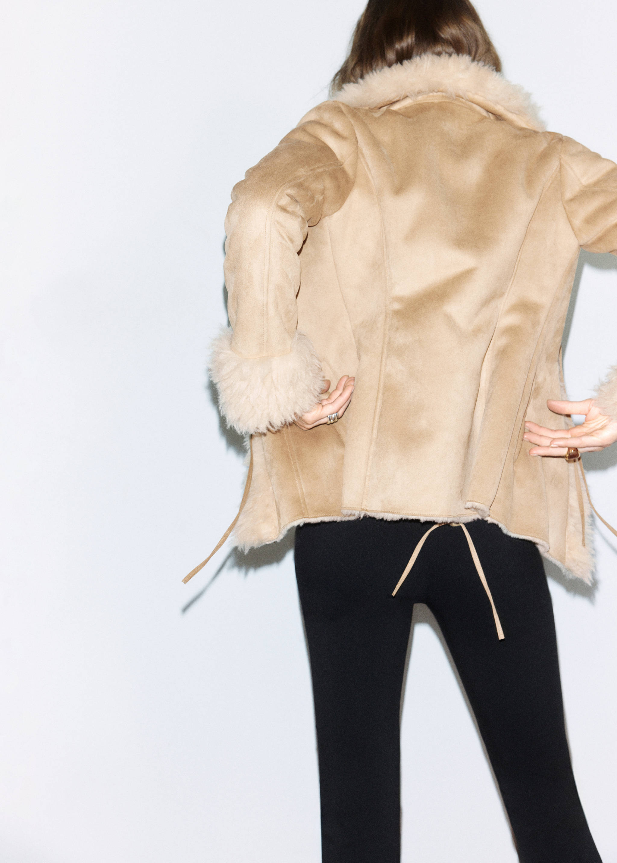 Camel faux-suede jacket with cream faux-shearling trim, back view.