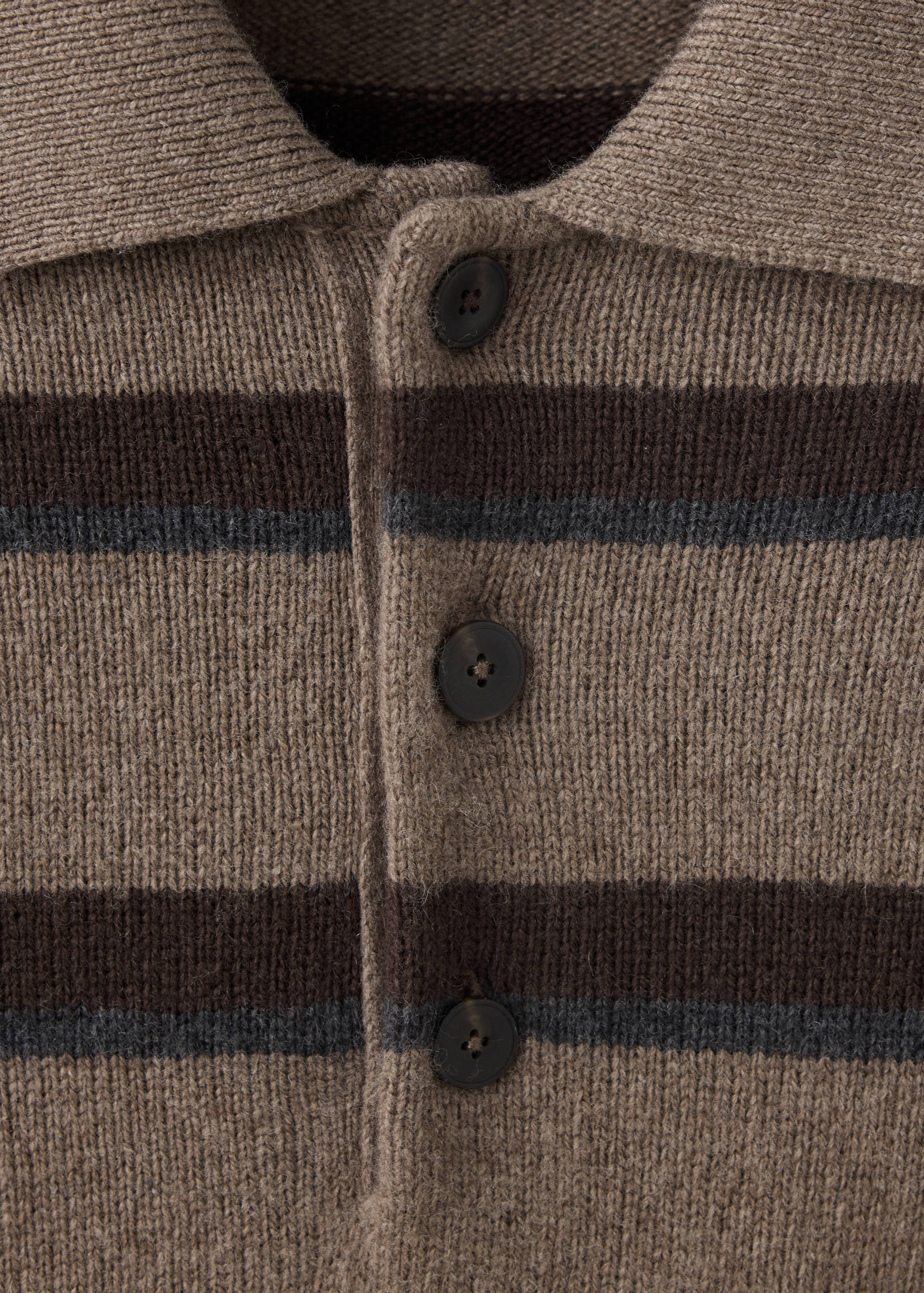 Close-up of a brown striped knit polo with a button placket.