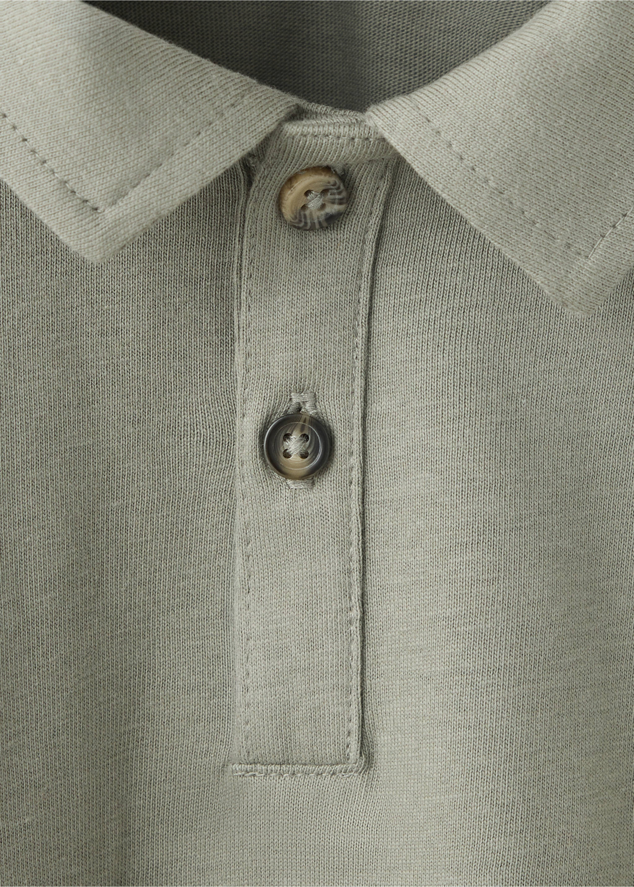 Close-up of a sage green polo shirt collar and button placket., Medium Green. Ref: 37087919-00.