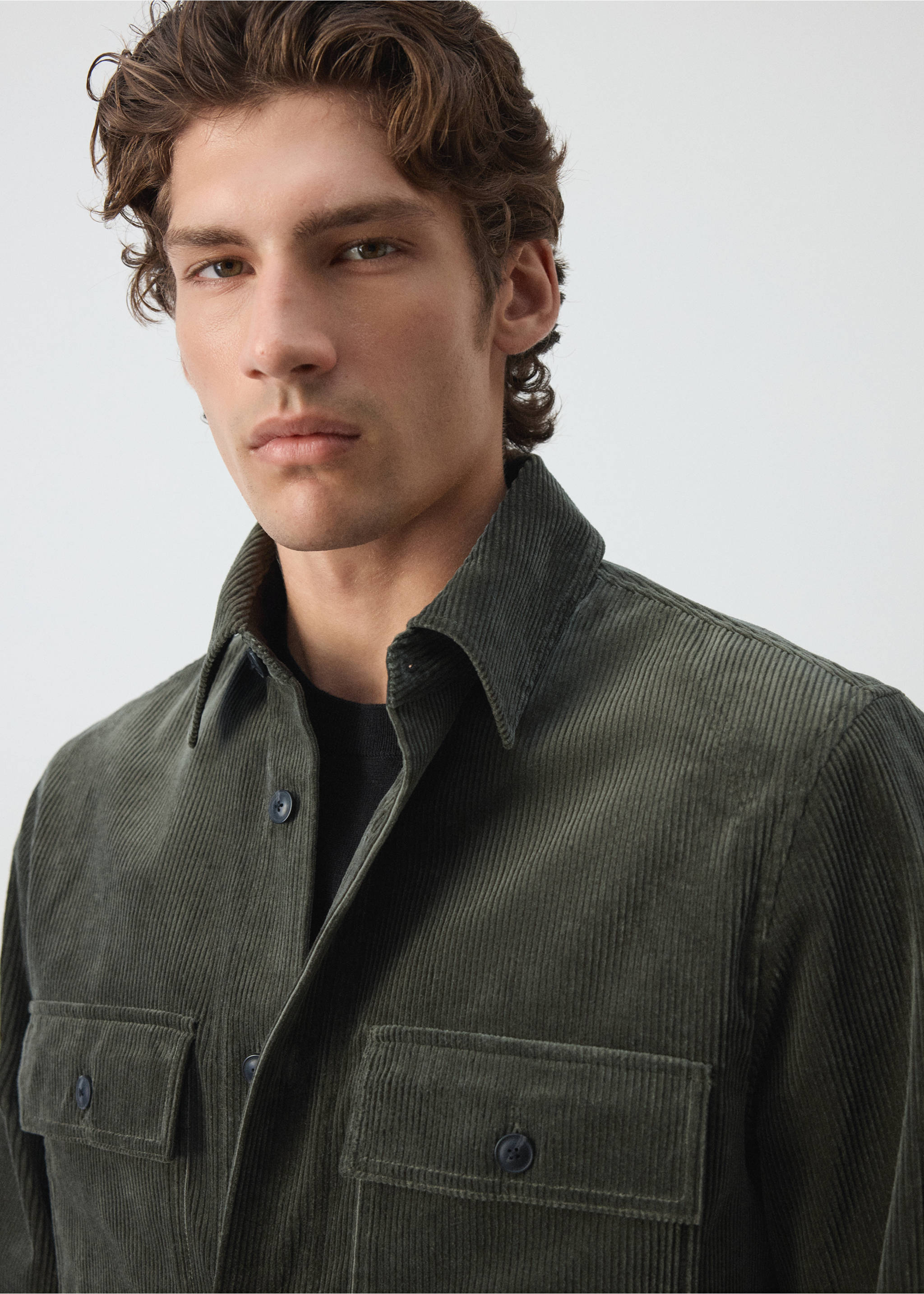 Dark green corduroy overshirt with chest pockets in a close-up model view., Dark Green. Ref: 37087920-00.