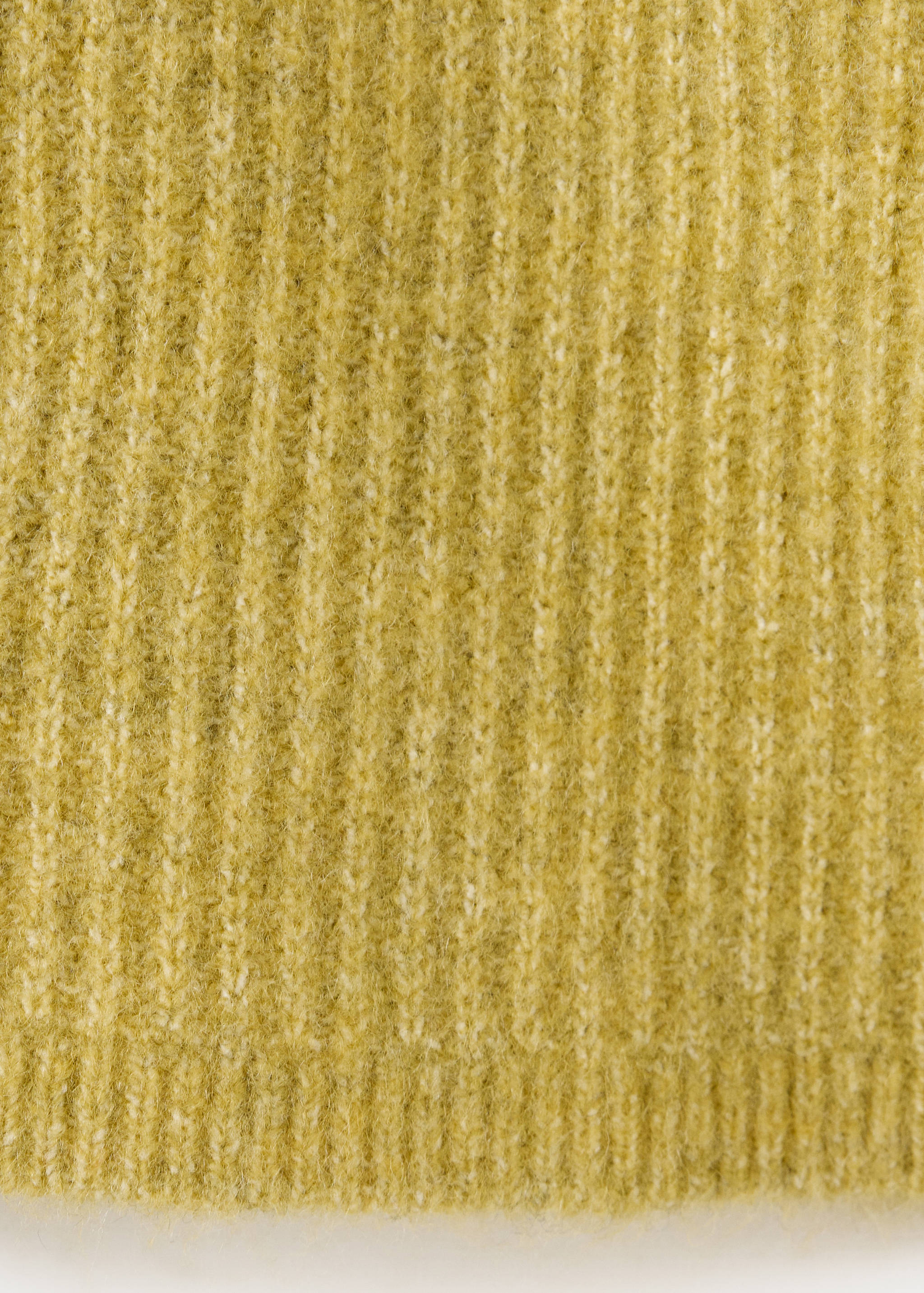 Yellow cardigan knit texture close-up.