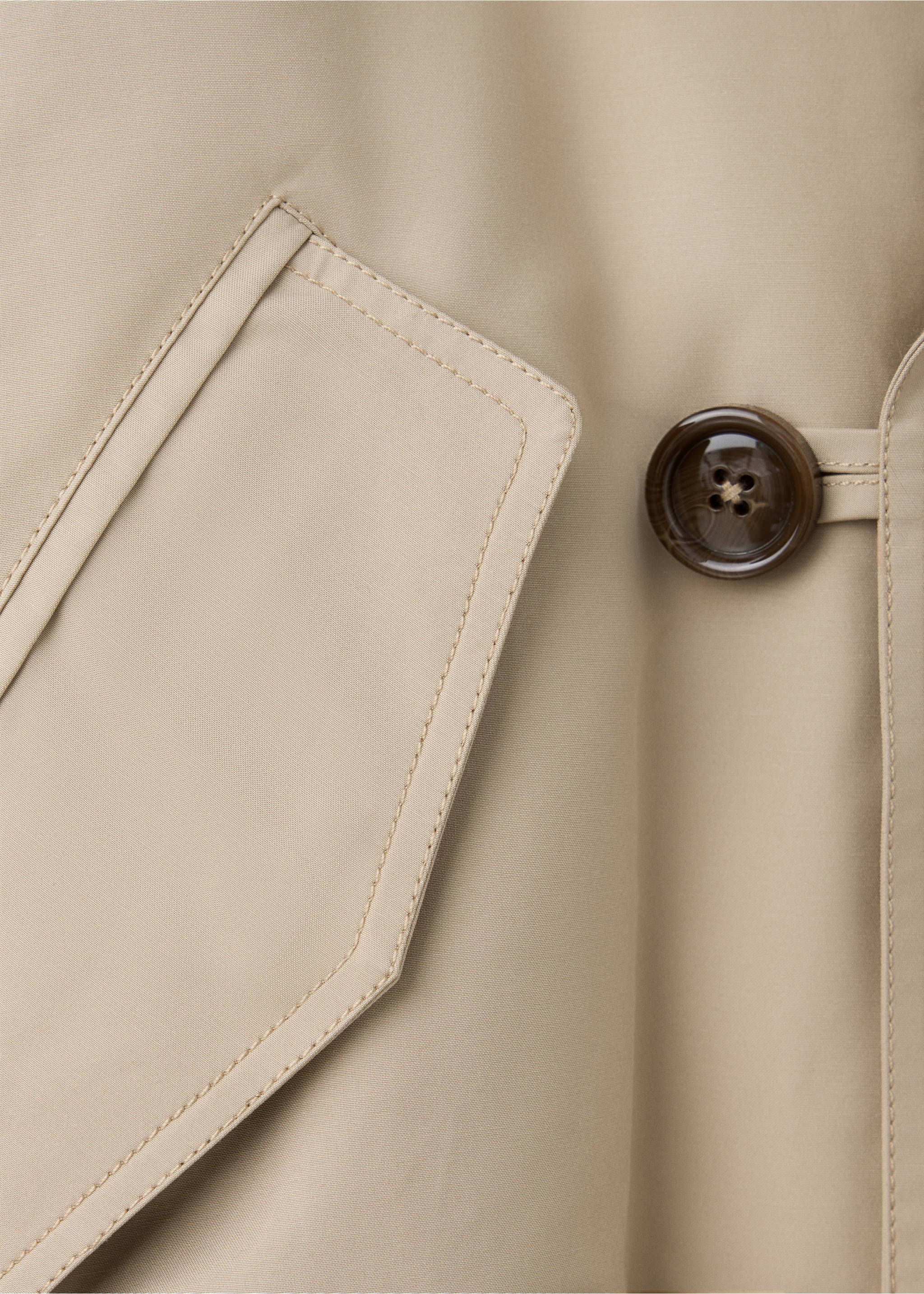 Close-up of a beige jacket showing the fabric detail, pocket flap, and tortoiseshell button., Beige. Ref: 37087938-00.