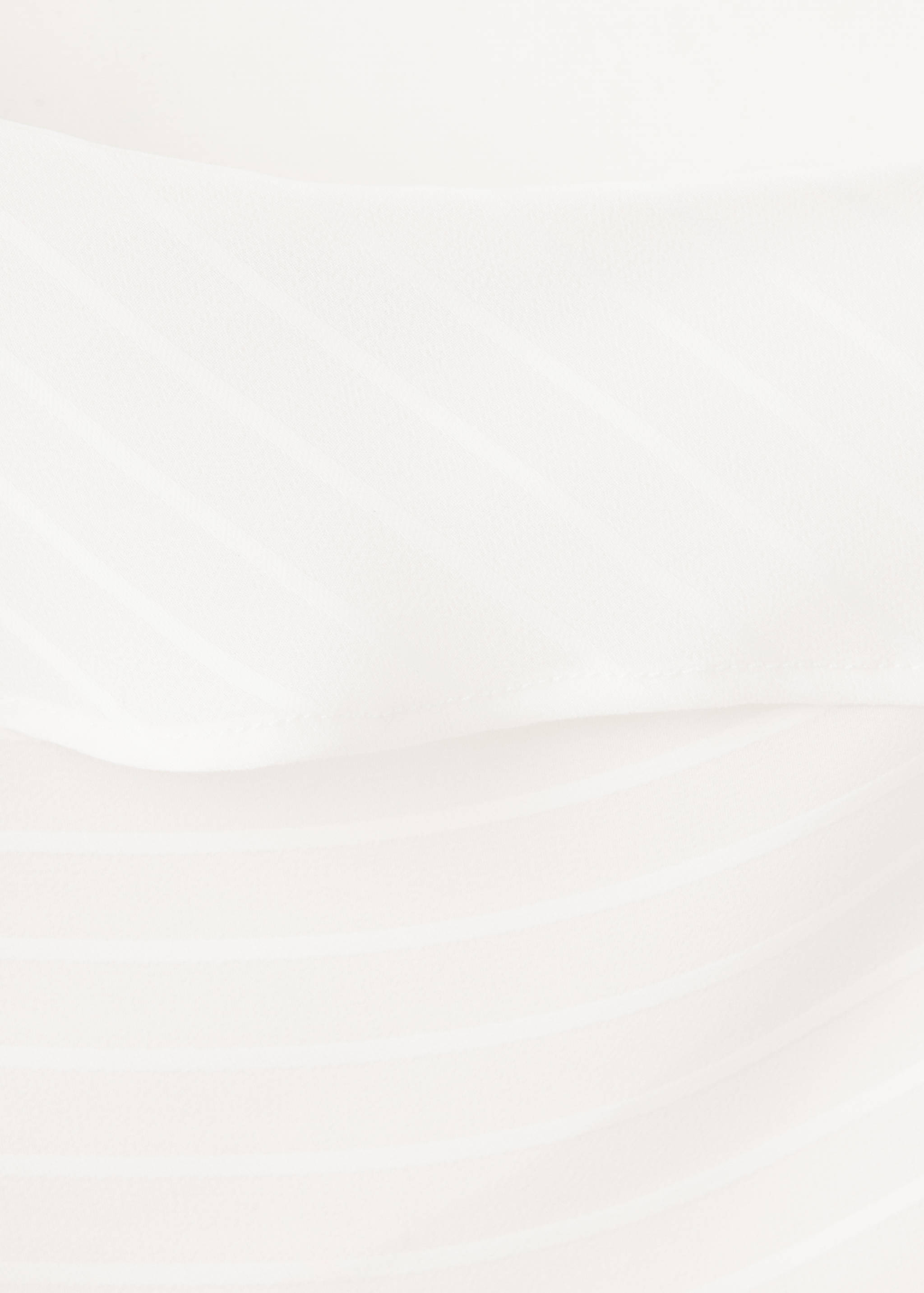 Close-up of fabric texture on a white top