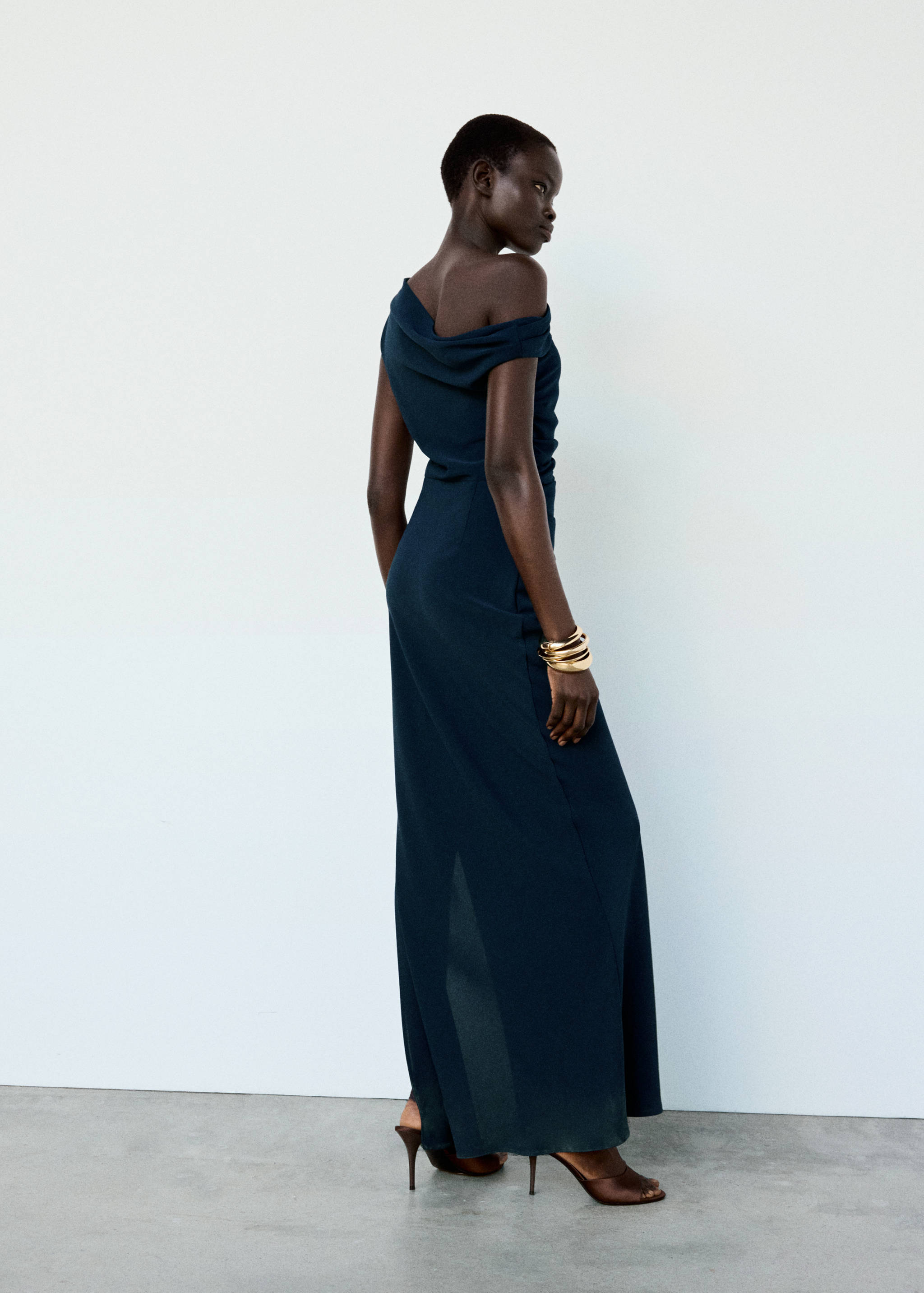 Dark blue off-the-shoulder floor-length dress, back view.