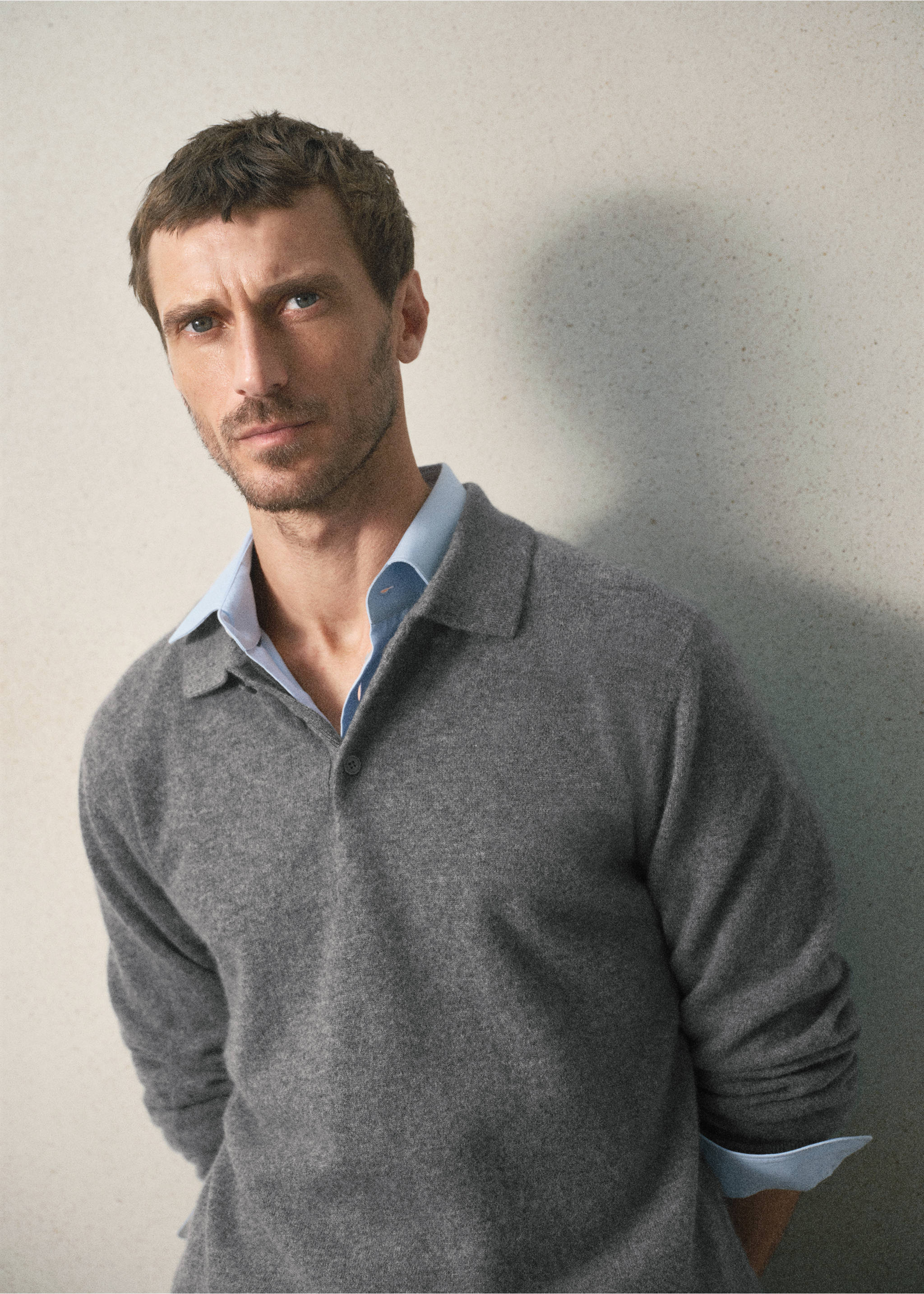 Grey knit polo shirt layered over a light blue shirt., Medium Heather Grey. Ref: 37088274-00.