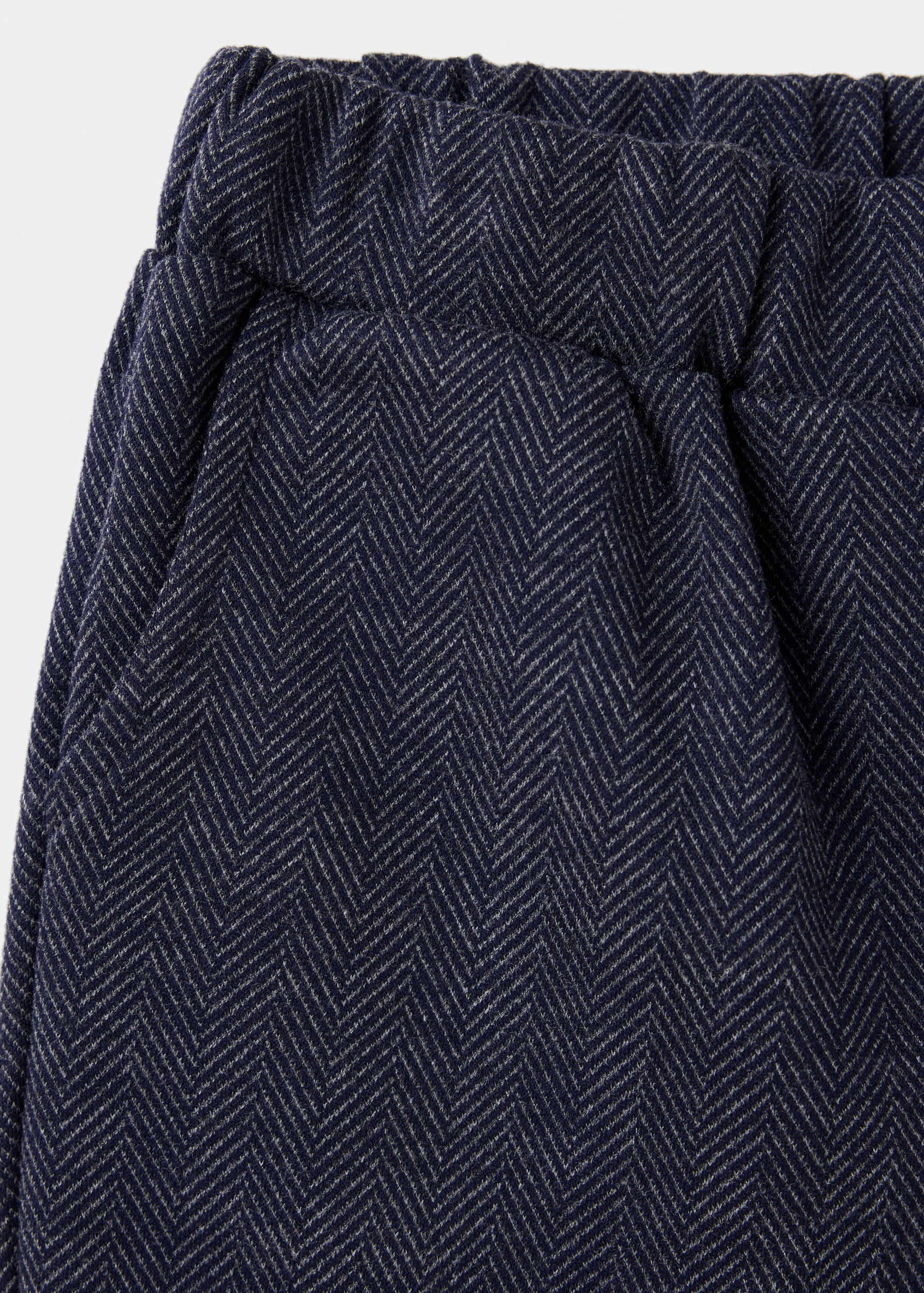 Navy blue herringbone trousers detail