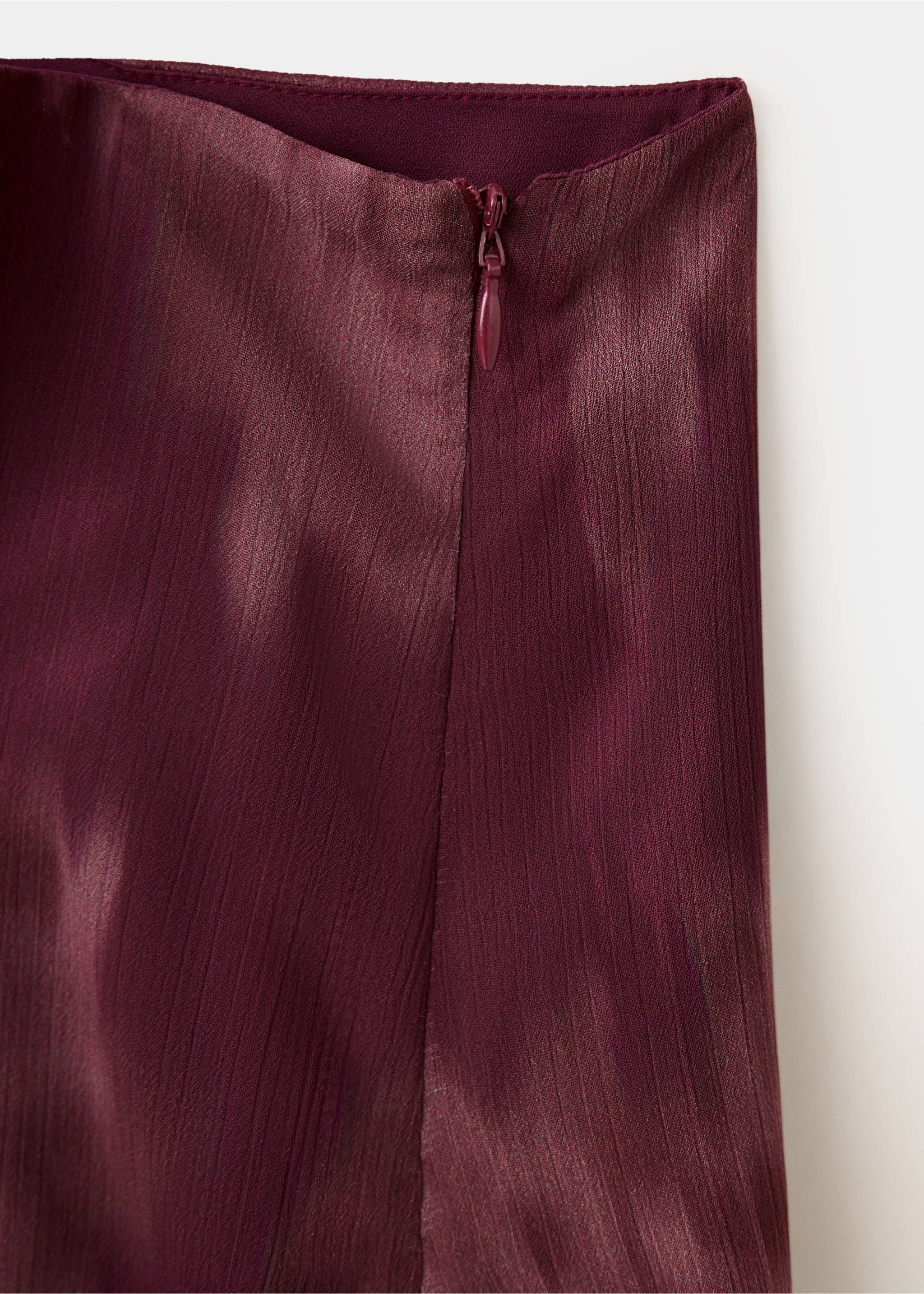 Burgundy skirt detail showing the side zipper and textured finish., Pink. Ref: 37088282-00.
