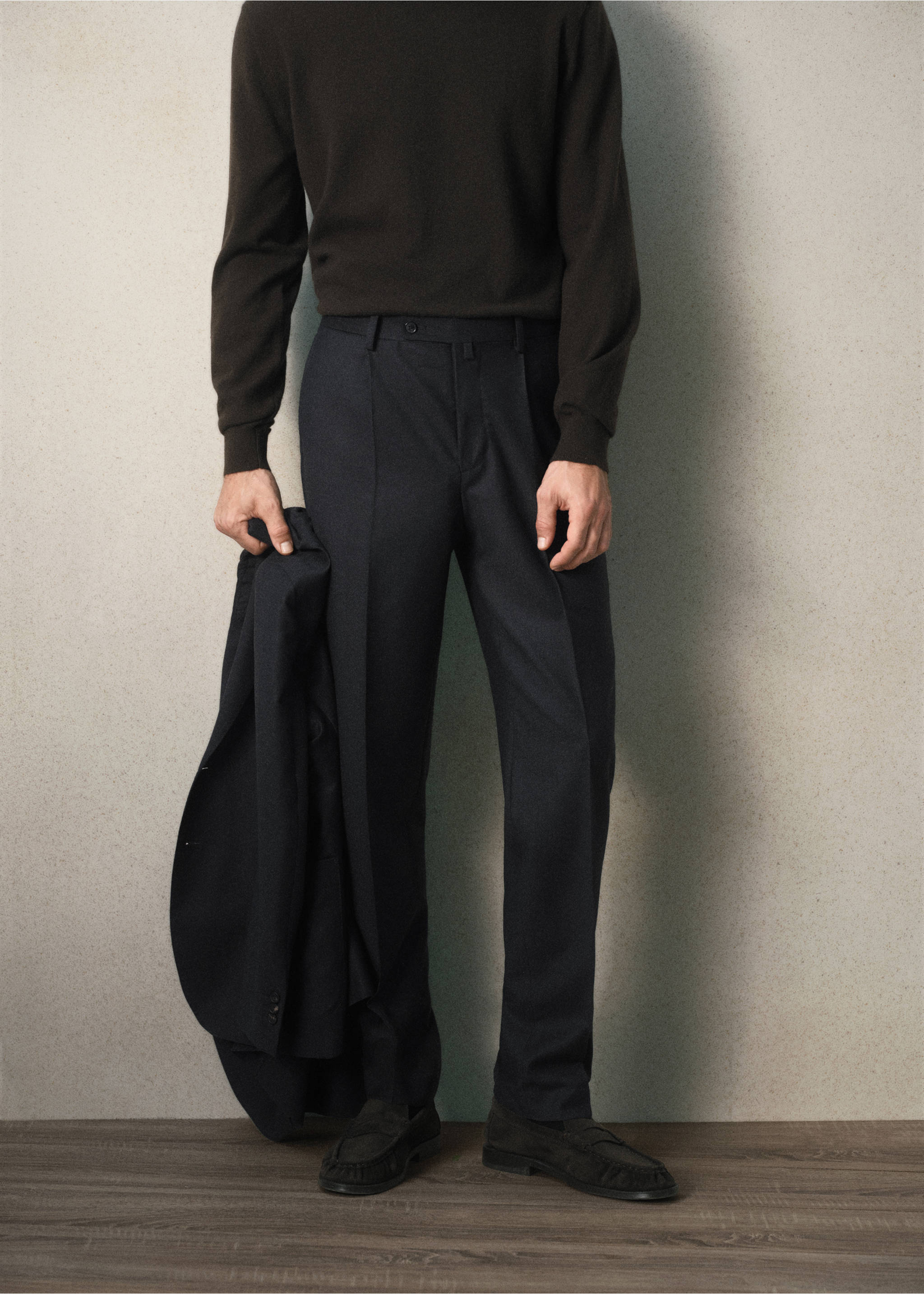 Dark navy blue trousers with front creases worn with a dark sweater., Charcoal. Ref: 37088283-00.