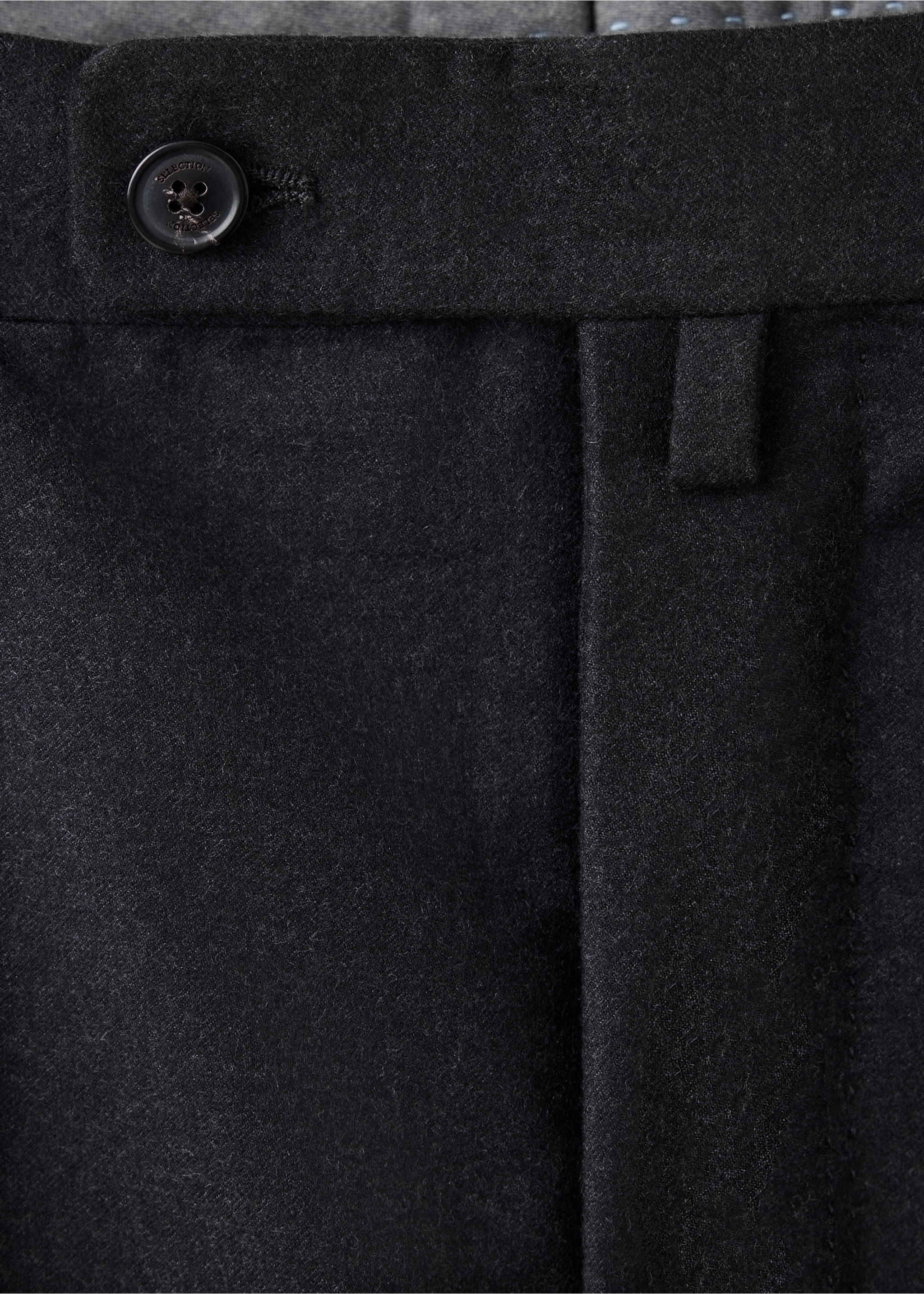 Close-up of dark grey trousers waistband with button detail., Charcoal. Ref: 37088283-00.