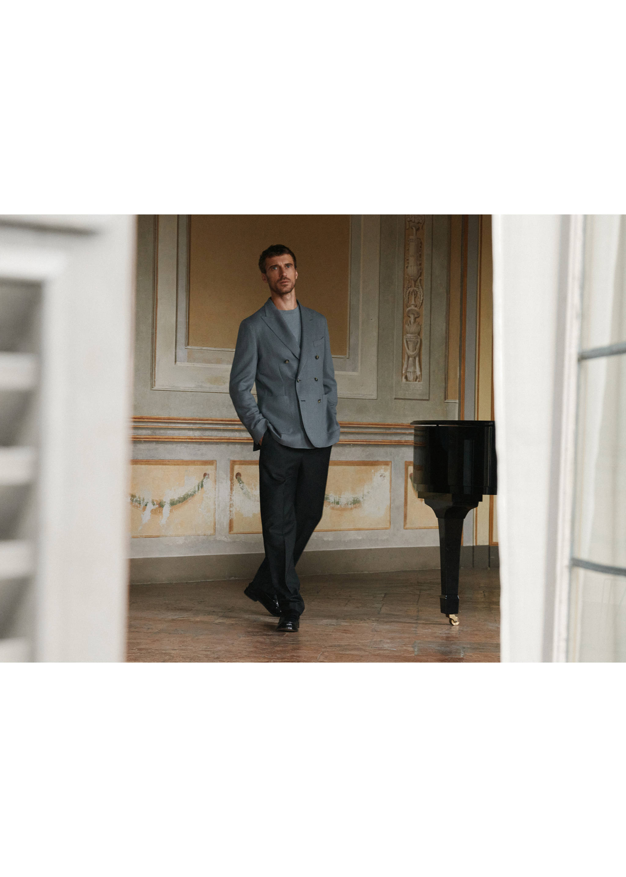 Dark straight-fit trousers worn with a grey double-breasted blazer., Charcoal. Ref: 37088283-00.