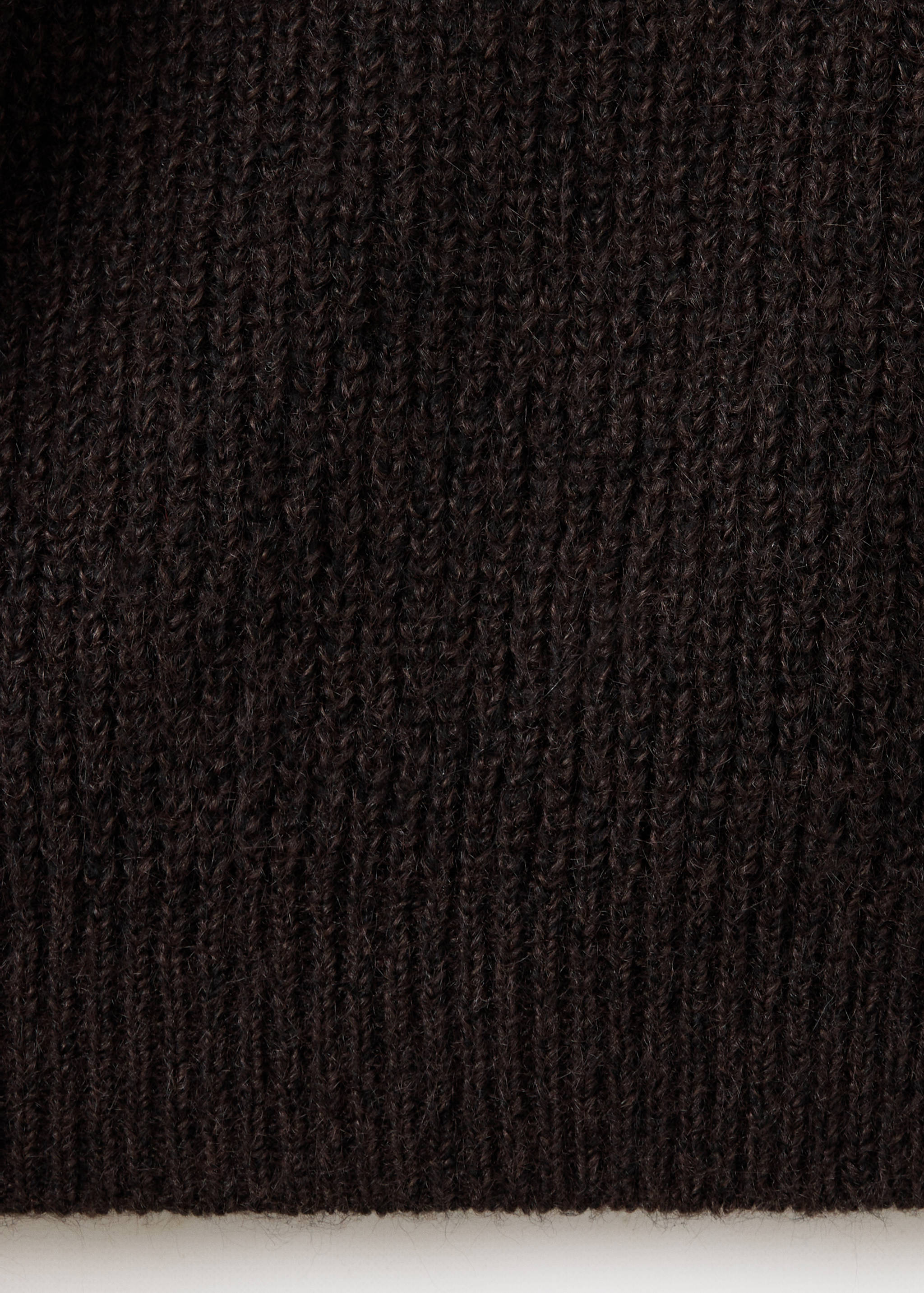 Close-up of a dark brown teen cardigan showing its ribbed knit texture.