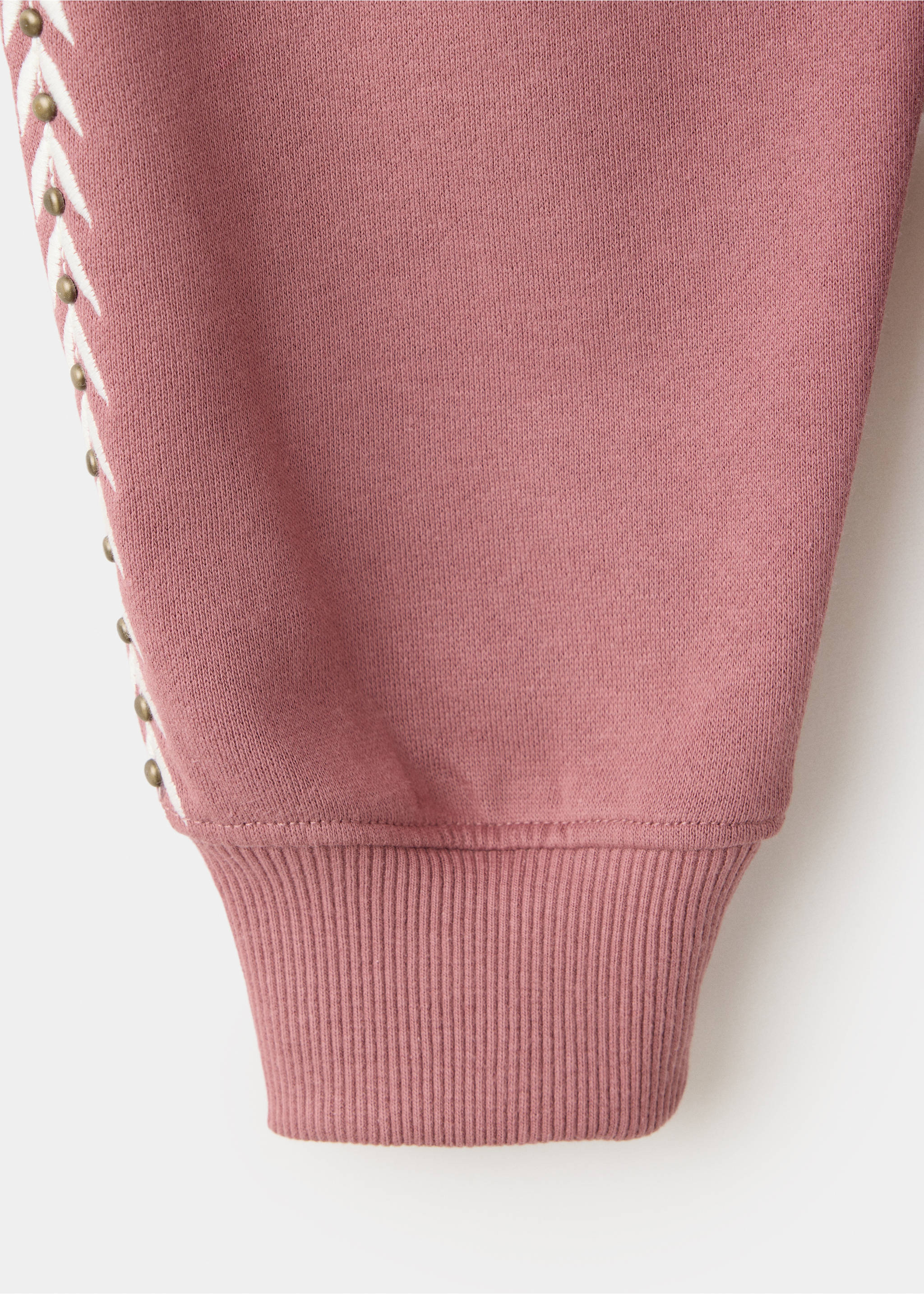 Detalle de tejido de sudadera en color malva con ribete lateral blanco de tachuelas., Rosa. Ref: 37088286-00.