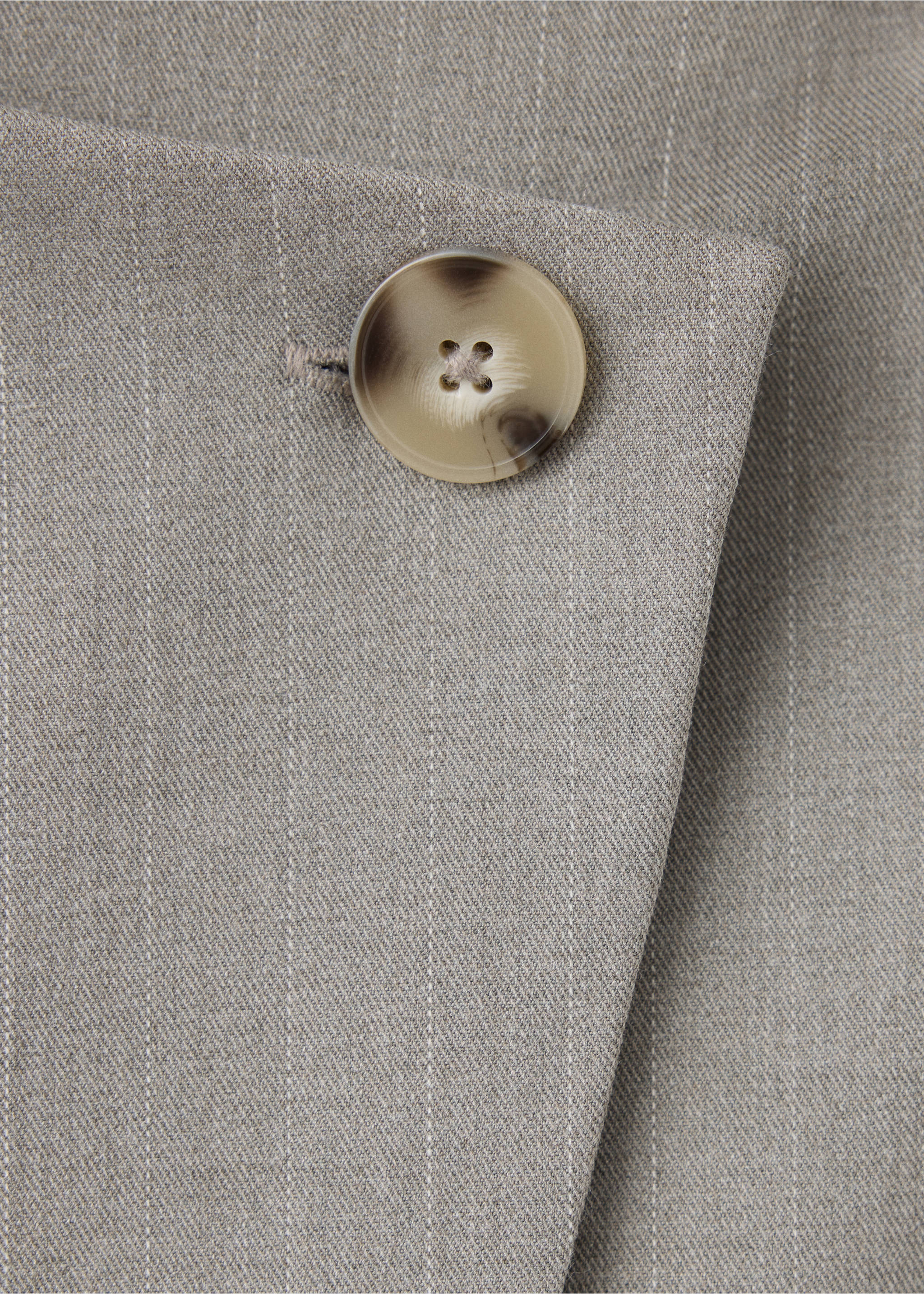 Close-up of a grey pinstripe skirt detail with a marbled button., Medium Brown. Ref: 37088639-00.