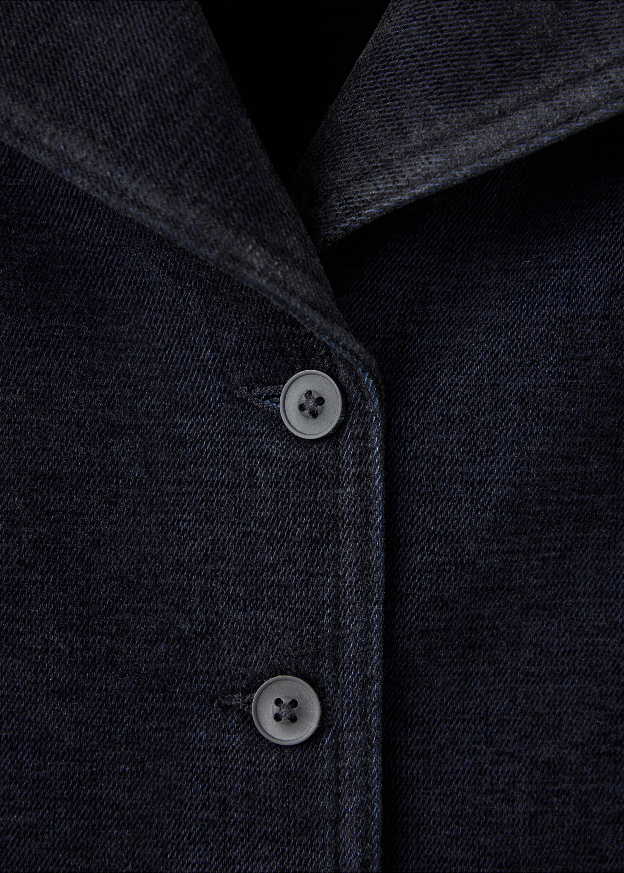 Close-up of a dark navy denim jacket showing the collar and button placket., Black. Ref: 37089113-00.