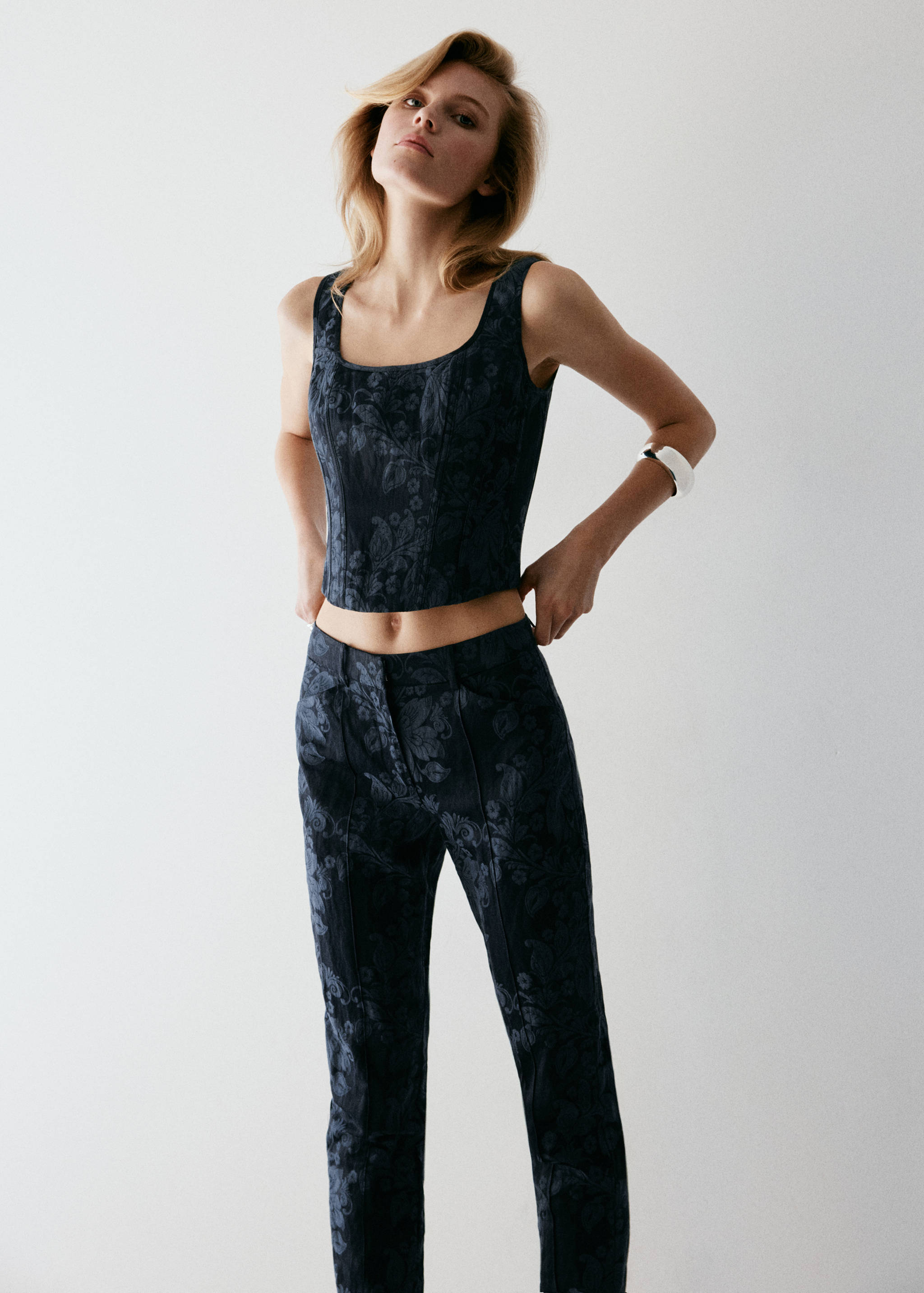 Dark blue jacquard trousers with matching crop top.