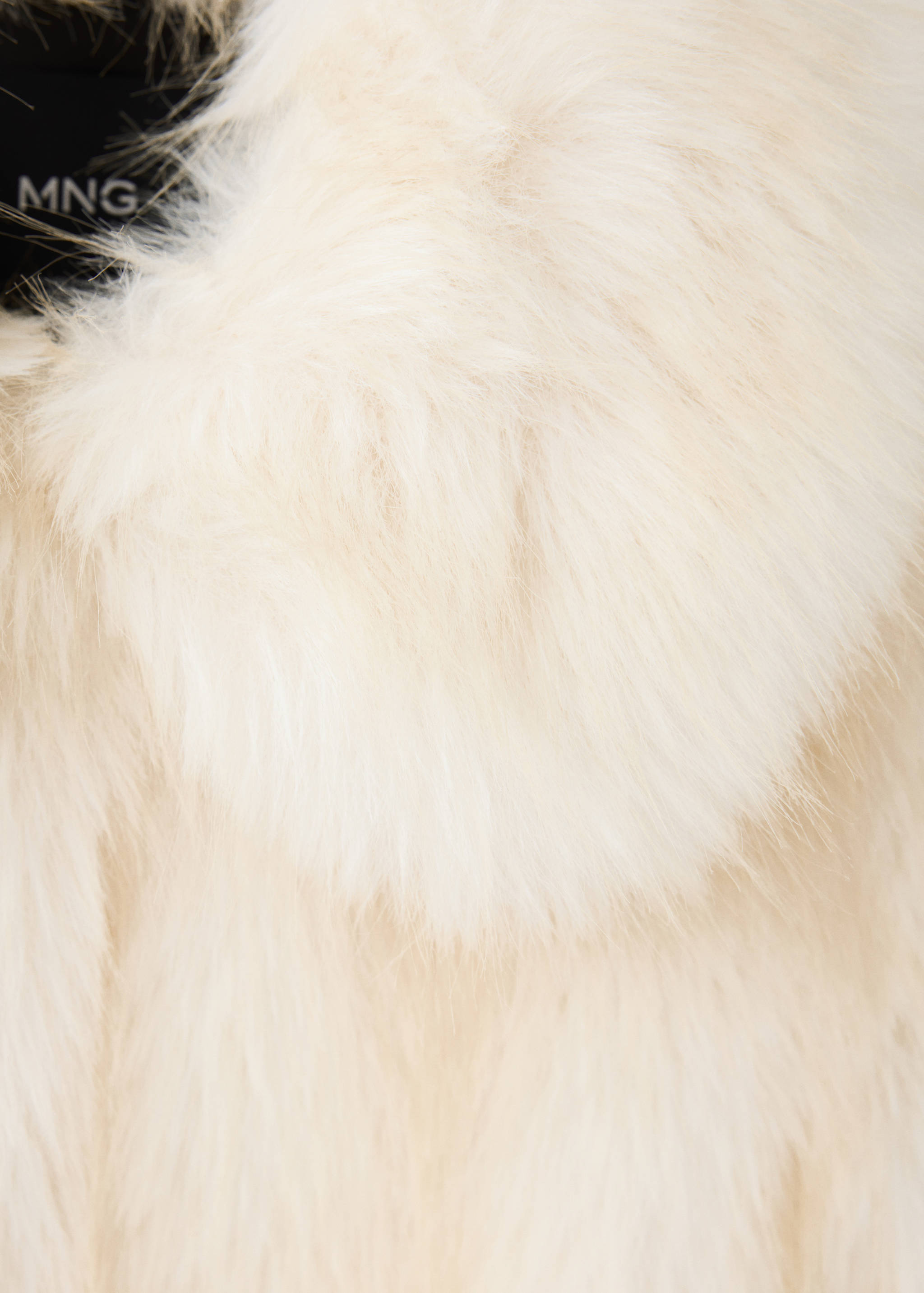 Cream faux-fur jacket detail showing the collar.