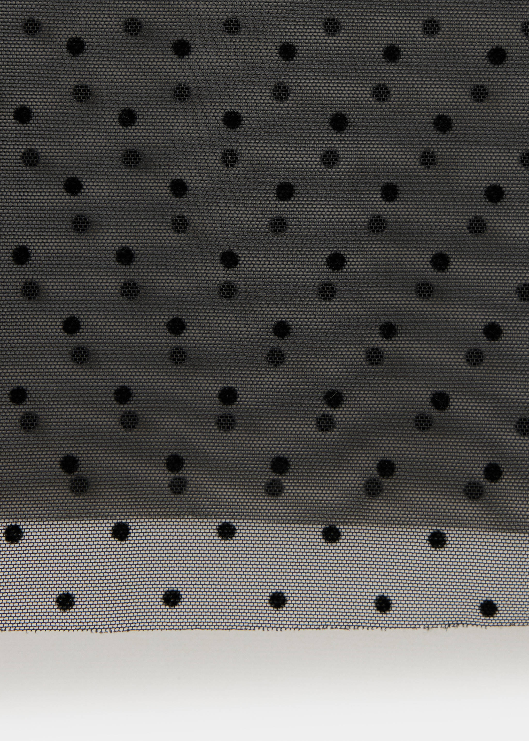 Close-up of black sheer mesh blouse fabric with flocked polka dots., Black. Ref: 37089128-00.