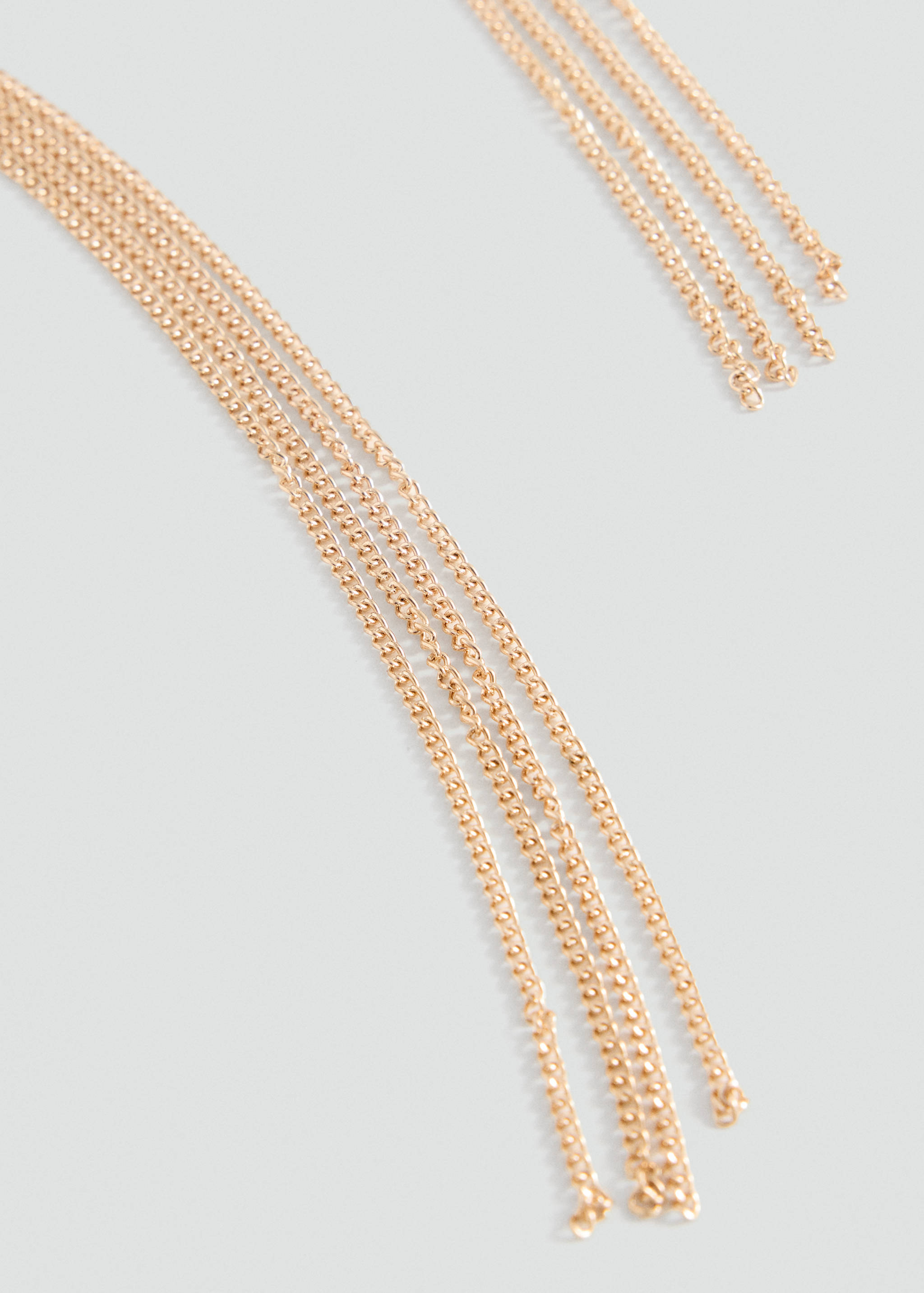 Close-up of a gold multi-strand chain collar.