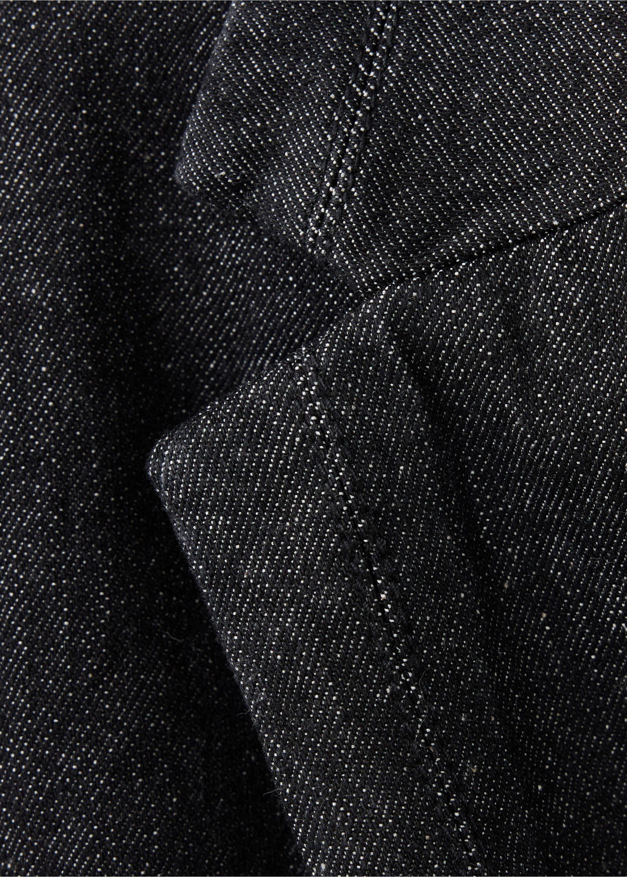 Close-up of the dark denim fabric and lapel of a blazer., Open Blue. Ref: 37089134-00.