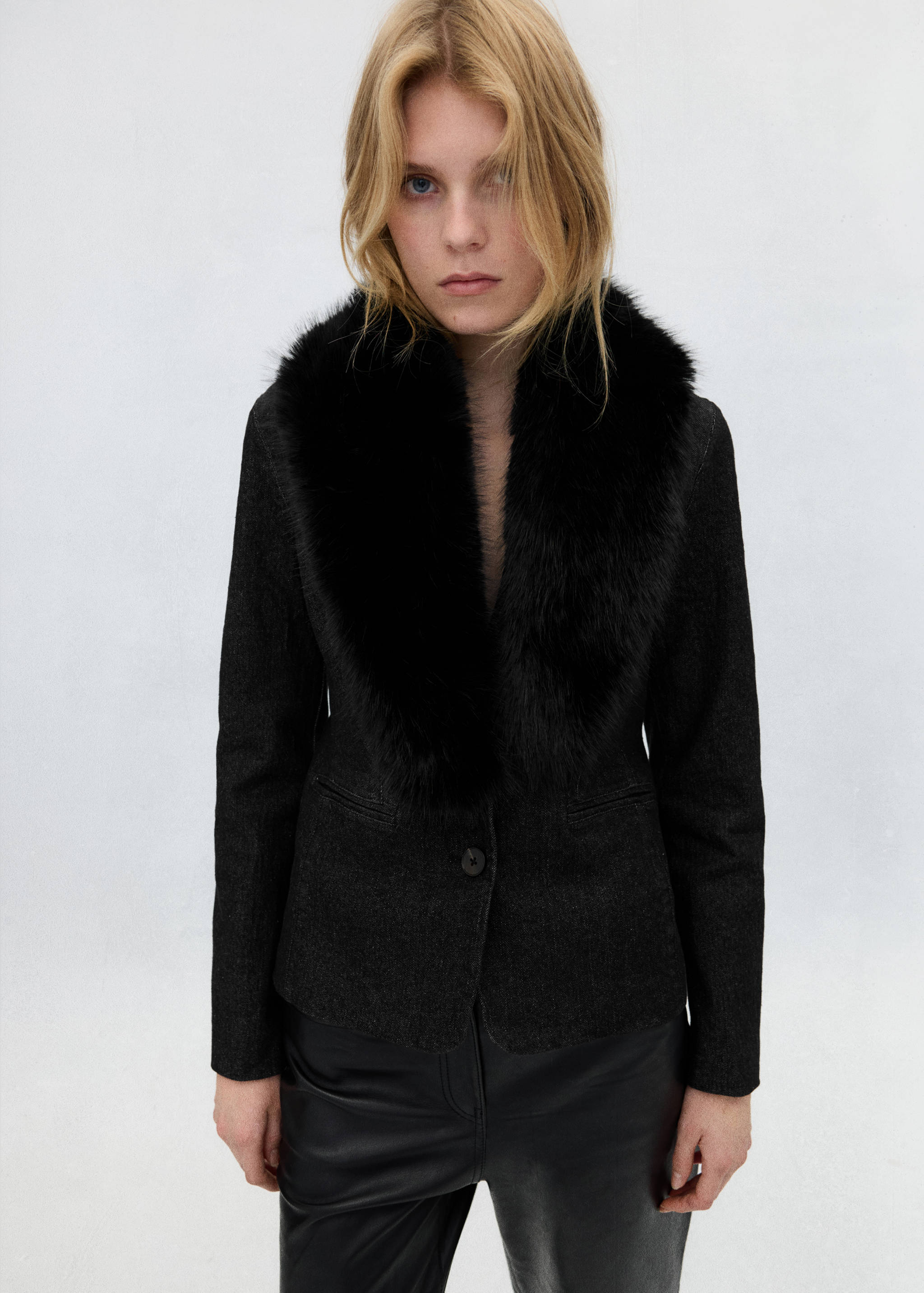 Dark grey blazer with a plush black faux-fur collar and single-button closure.