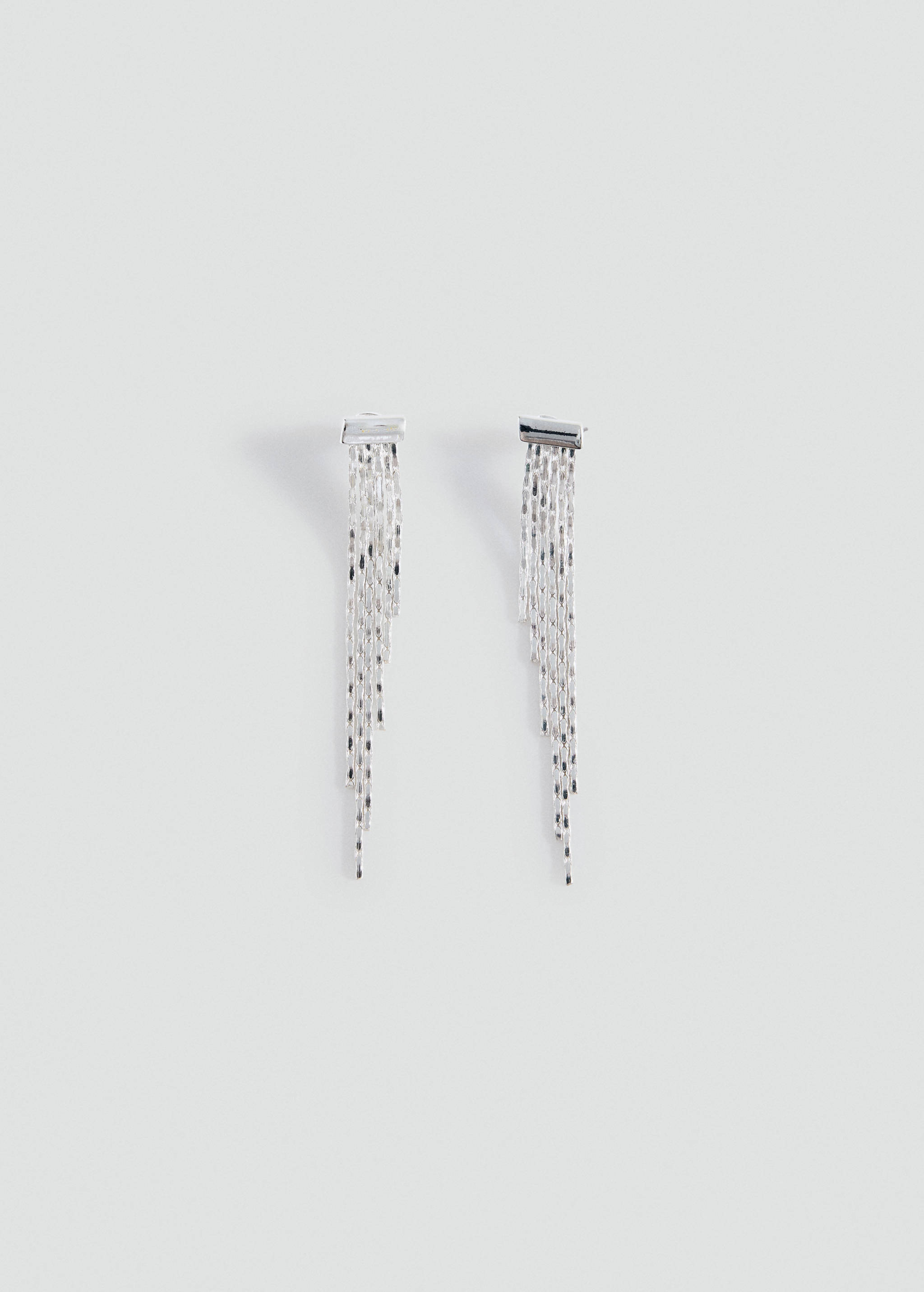 Silver-coloured dangling earrings with cascading fringe chains.