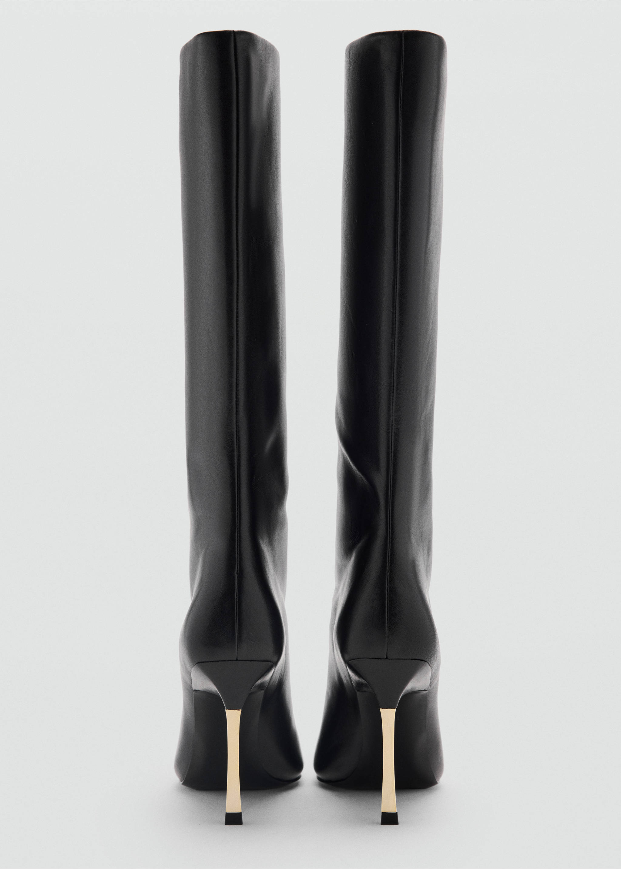 Pair of black knee-high boots featuring stiletto heels with gold metallic detail, rear view., Black. Ref: 37089138-00.