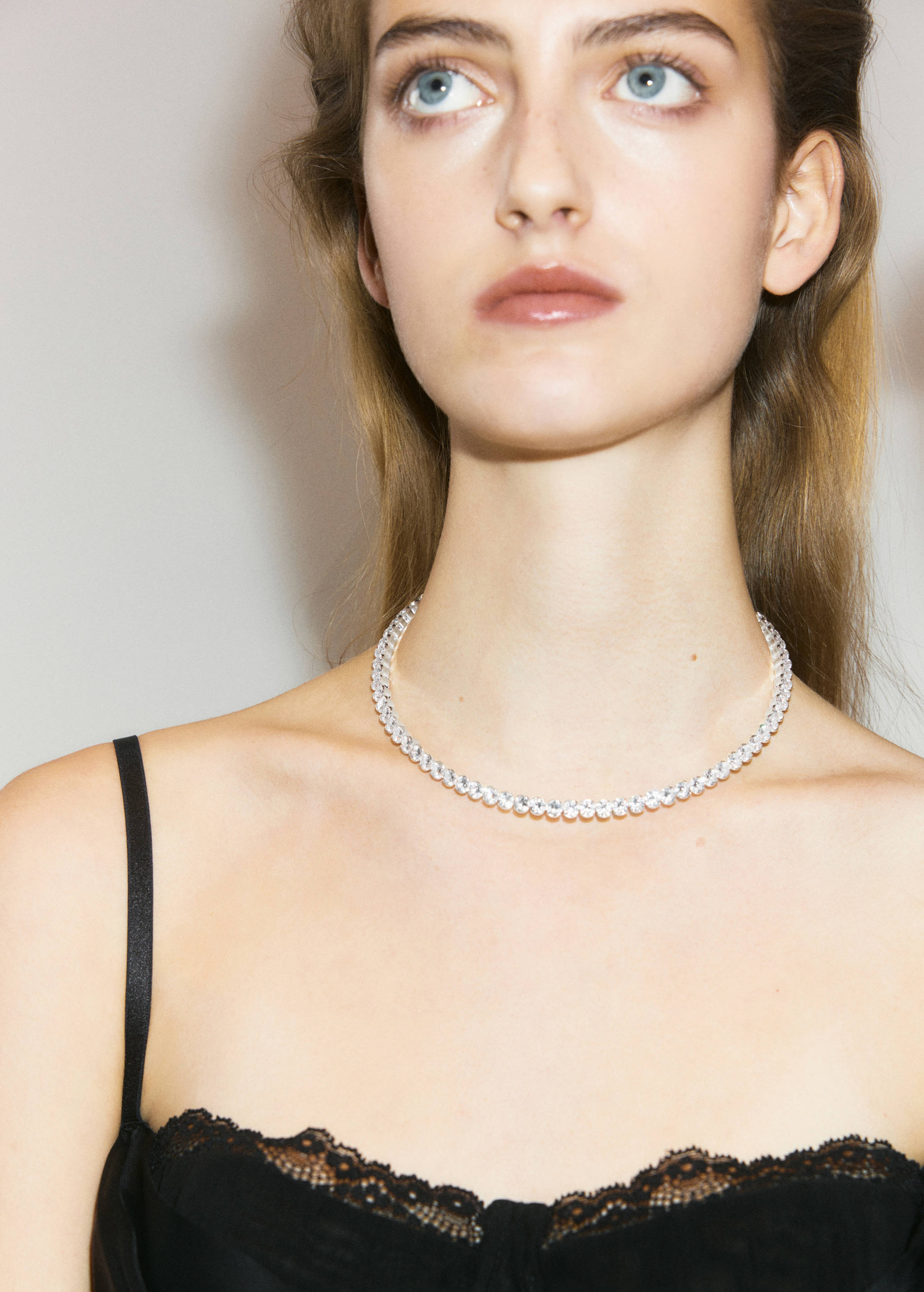 Crystal collar necklace with a continuous line of sparkling stones.