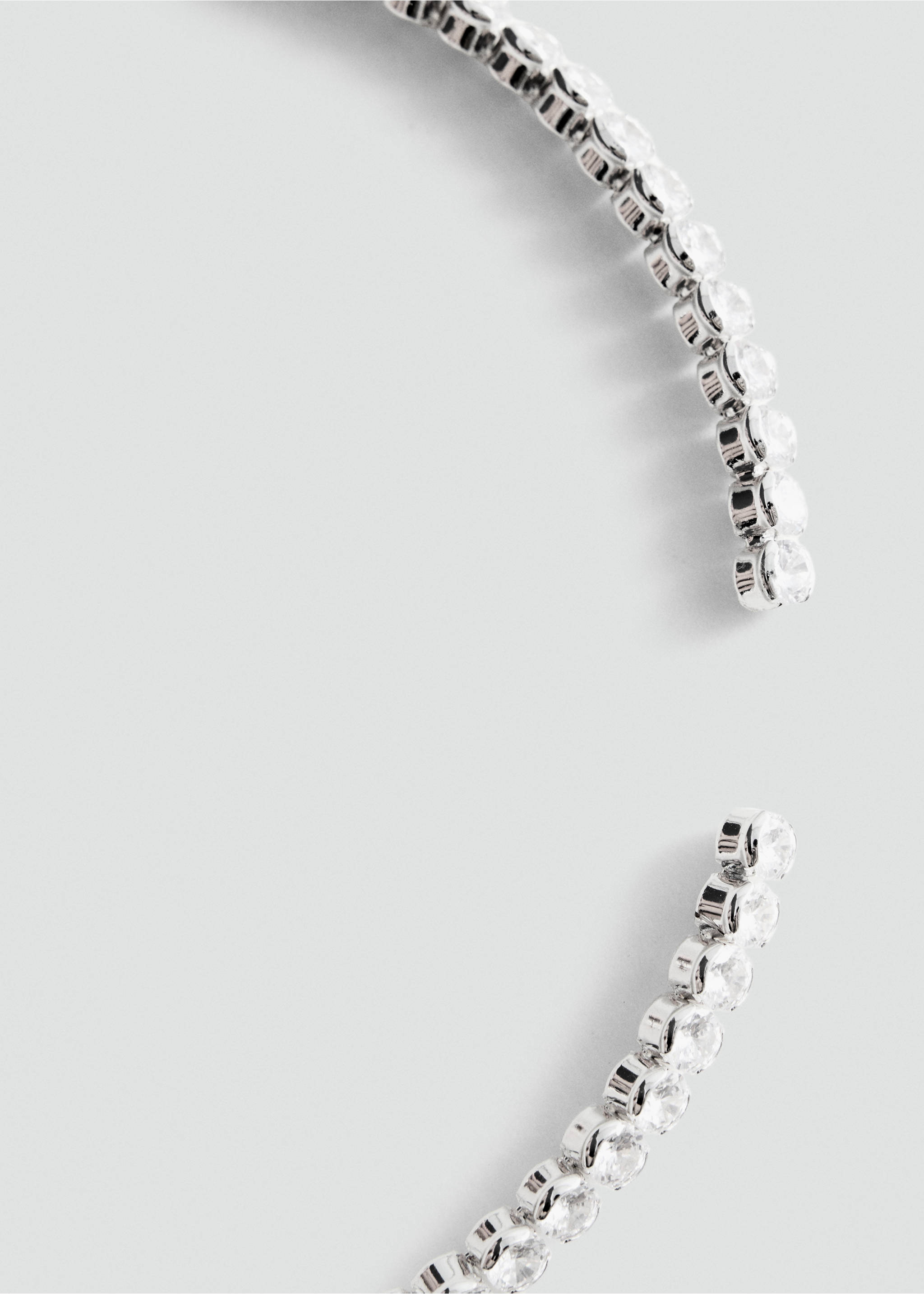 Close-up of a rhinestone collar necklace., Silver. Ref: 37089140-00.