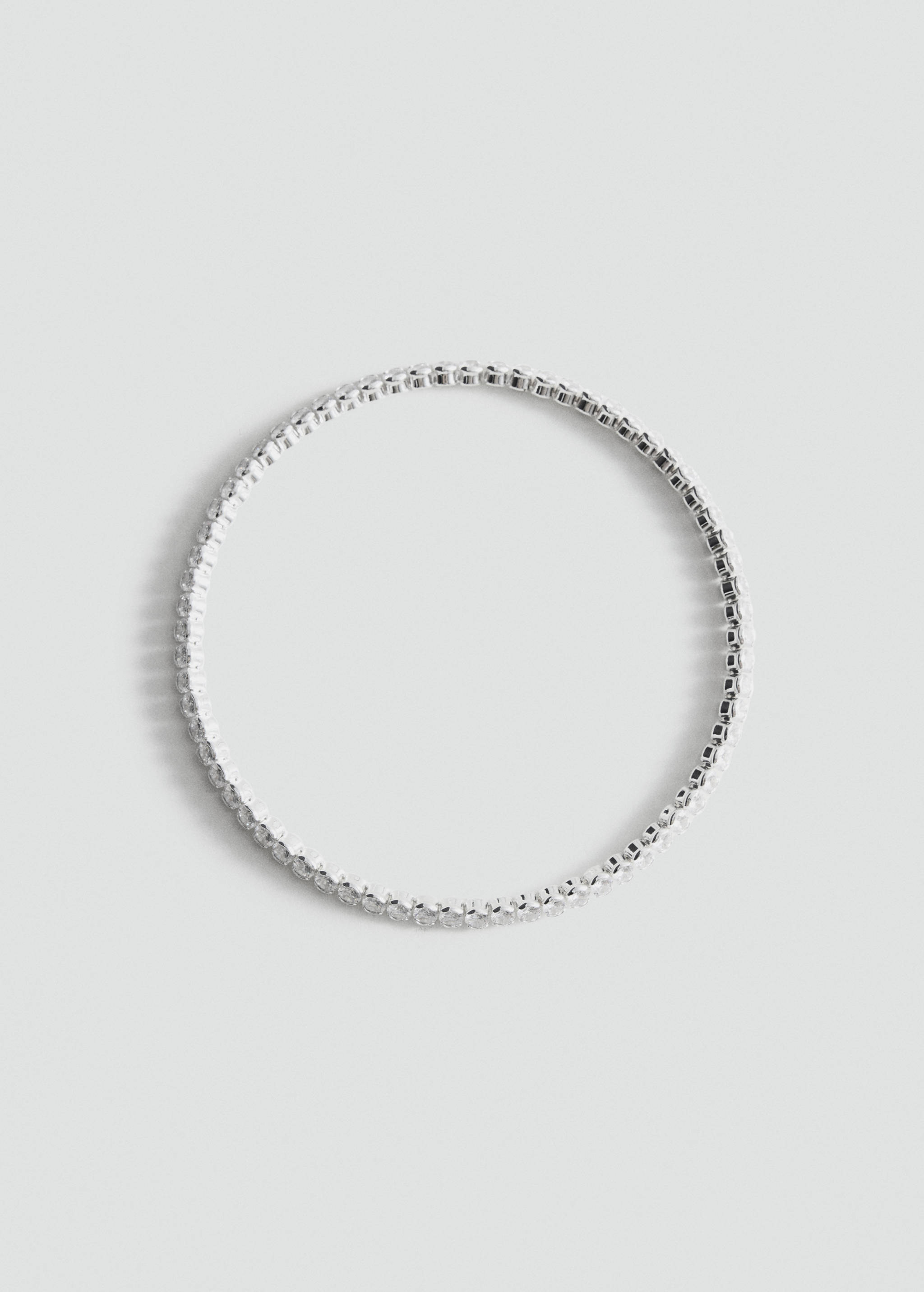 Silver-tone rhinestone-encrusted rigid collar.