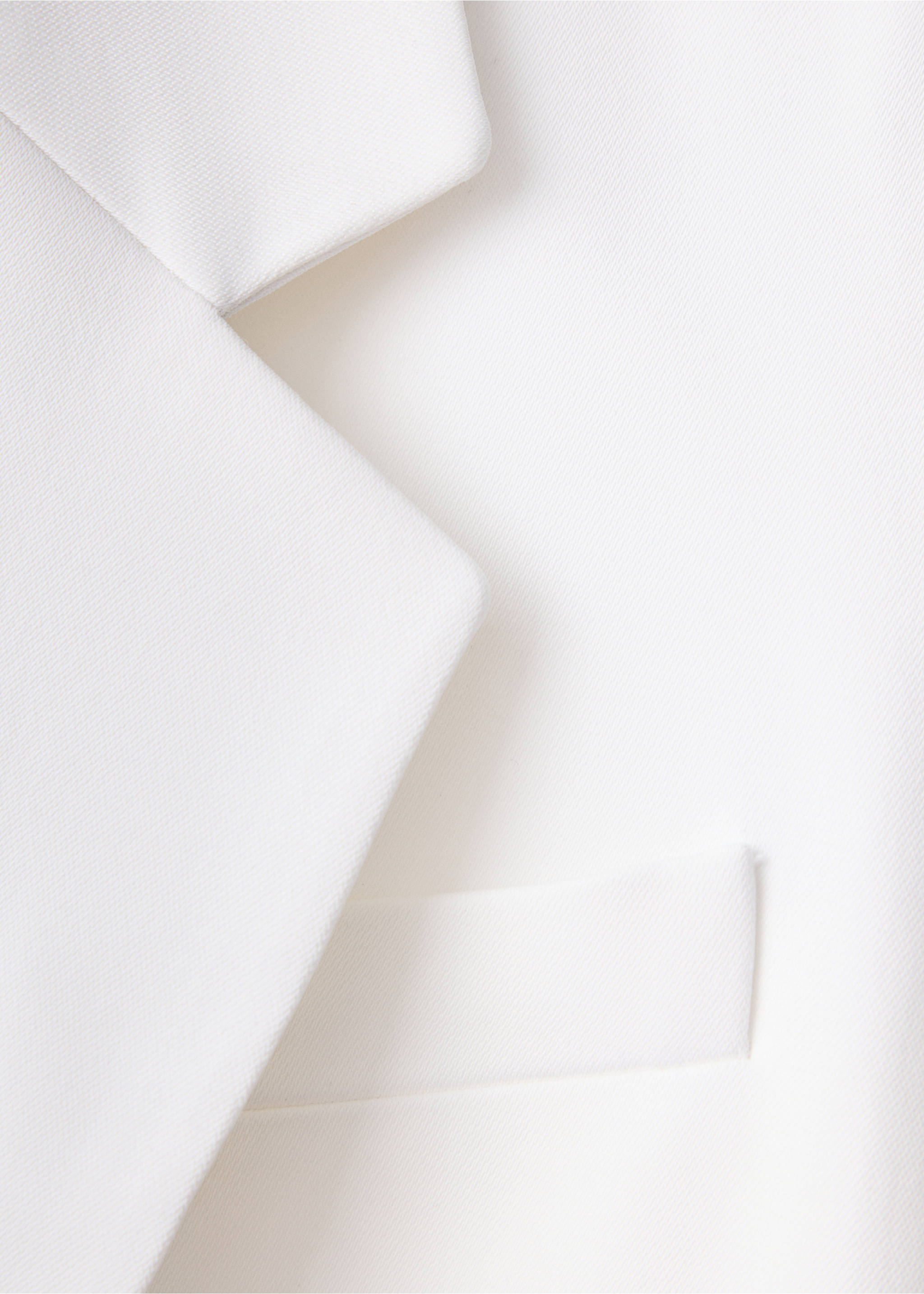 Close-up of lapel detail on a white dress., White. Ref: 37089142-00.